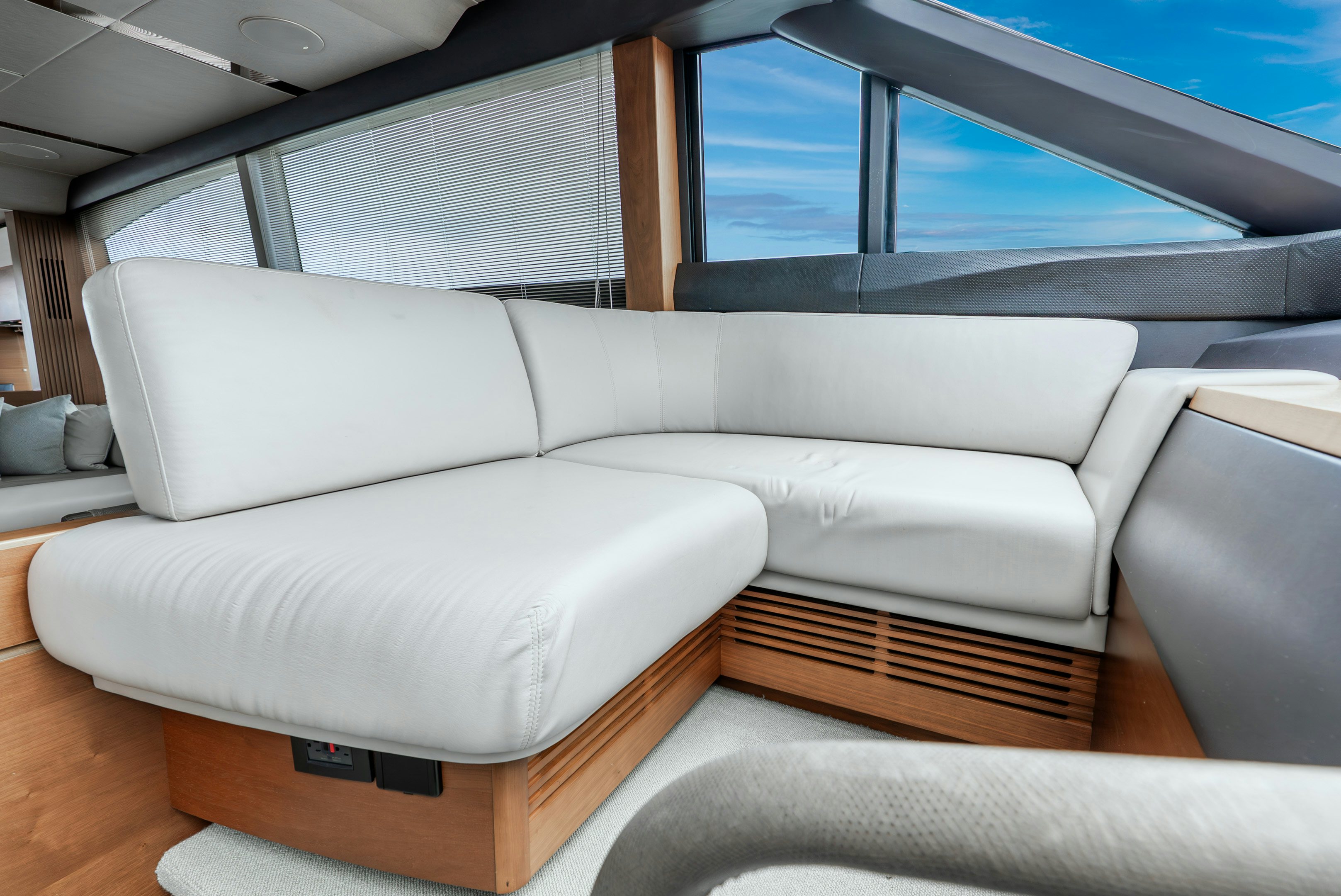a white couch in a room aboard MAMU Yacht for Sale