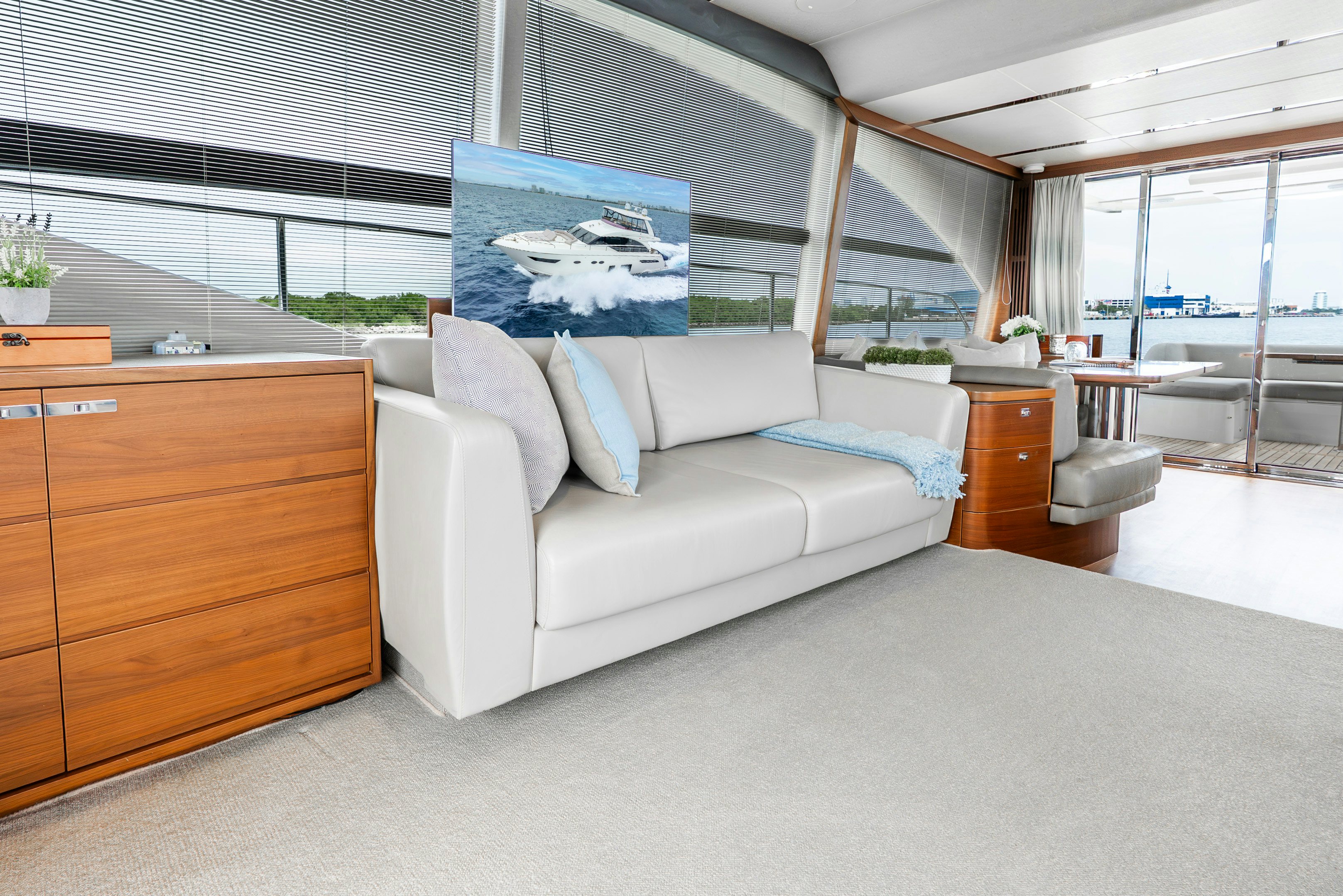 a white couch in a room aboard MAMU Yacht for Sale