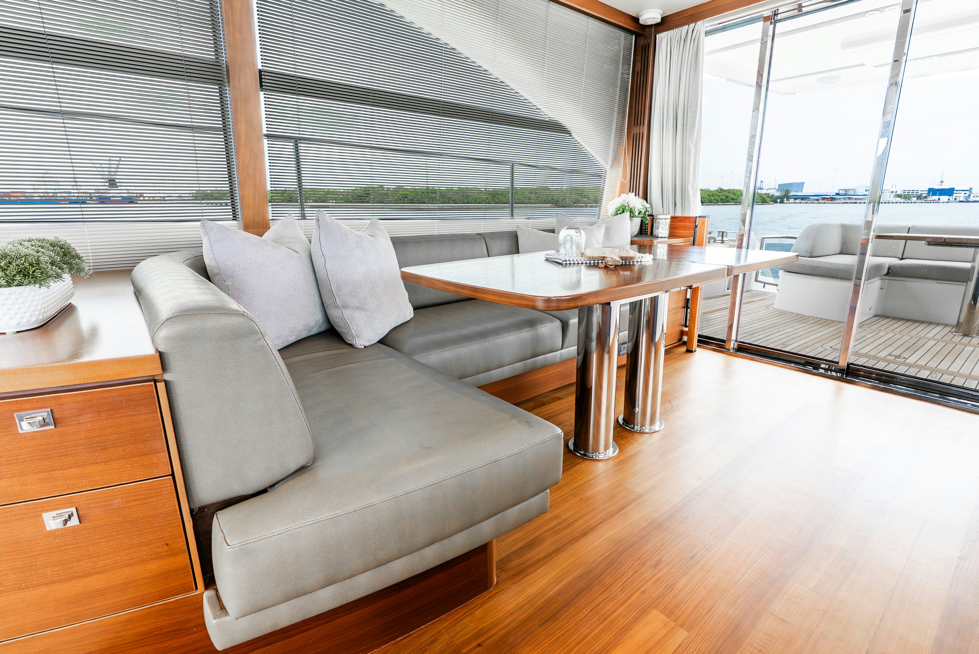 a room with a table and chairs aboard MAMU Yacht for Sale