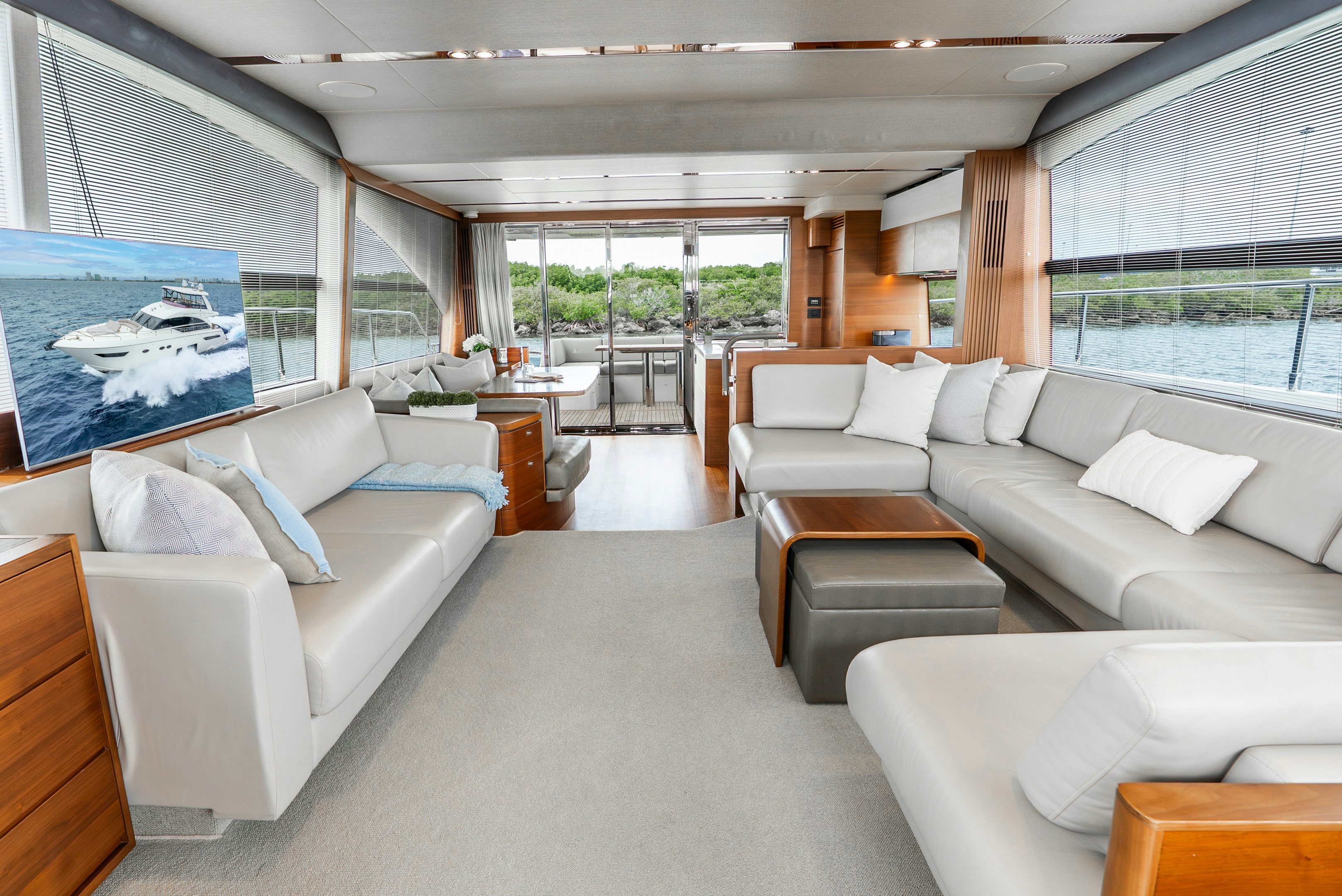 a living room with a large window aboard MAMU Yacht for Sale