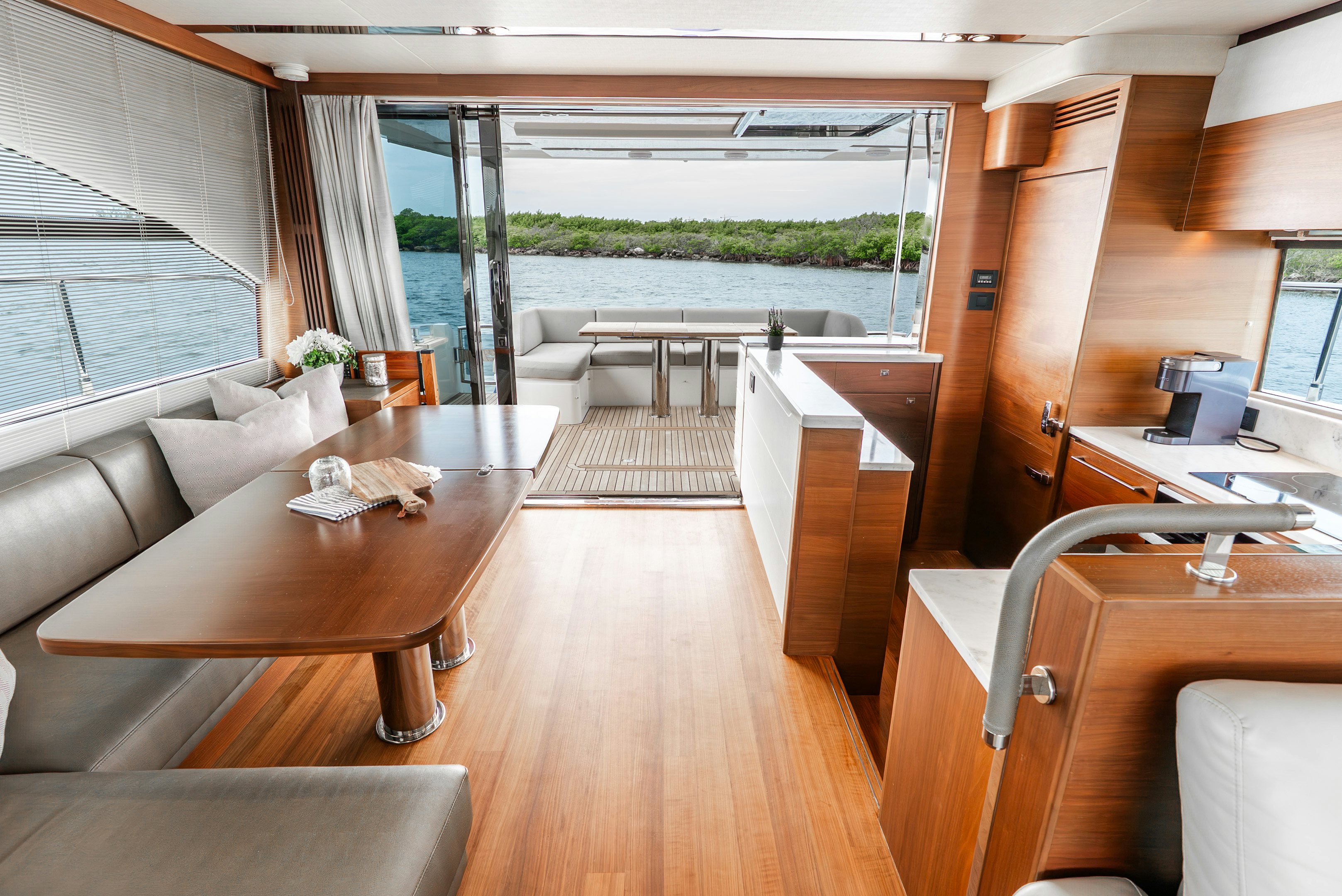 a room with a table chairs and a large window aboard MAMU Yacht for Sale