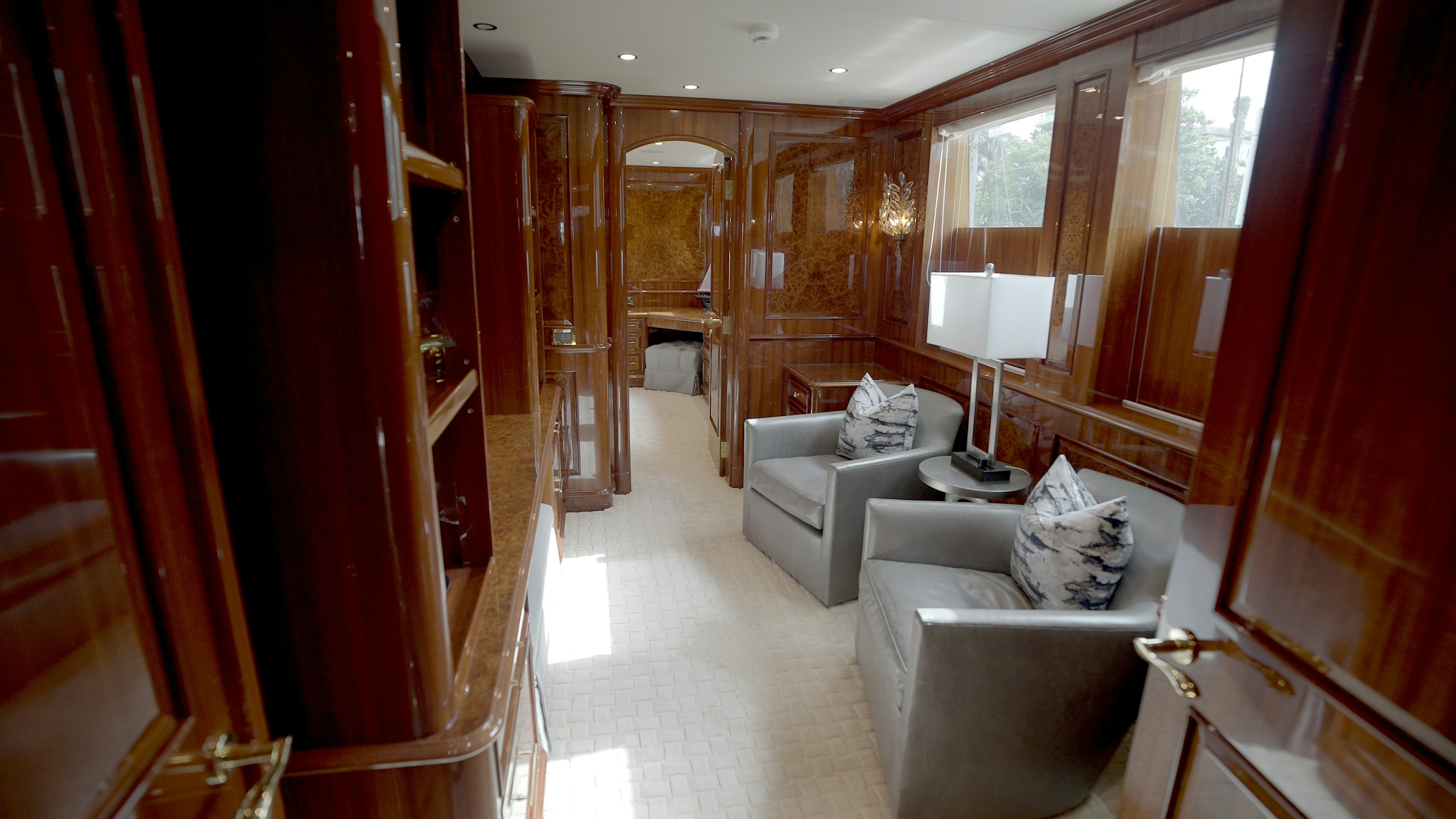 a living room with a couch and a lamp aboard HOMECOMING Yacht for Sale