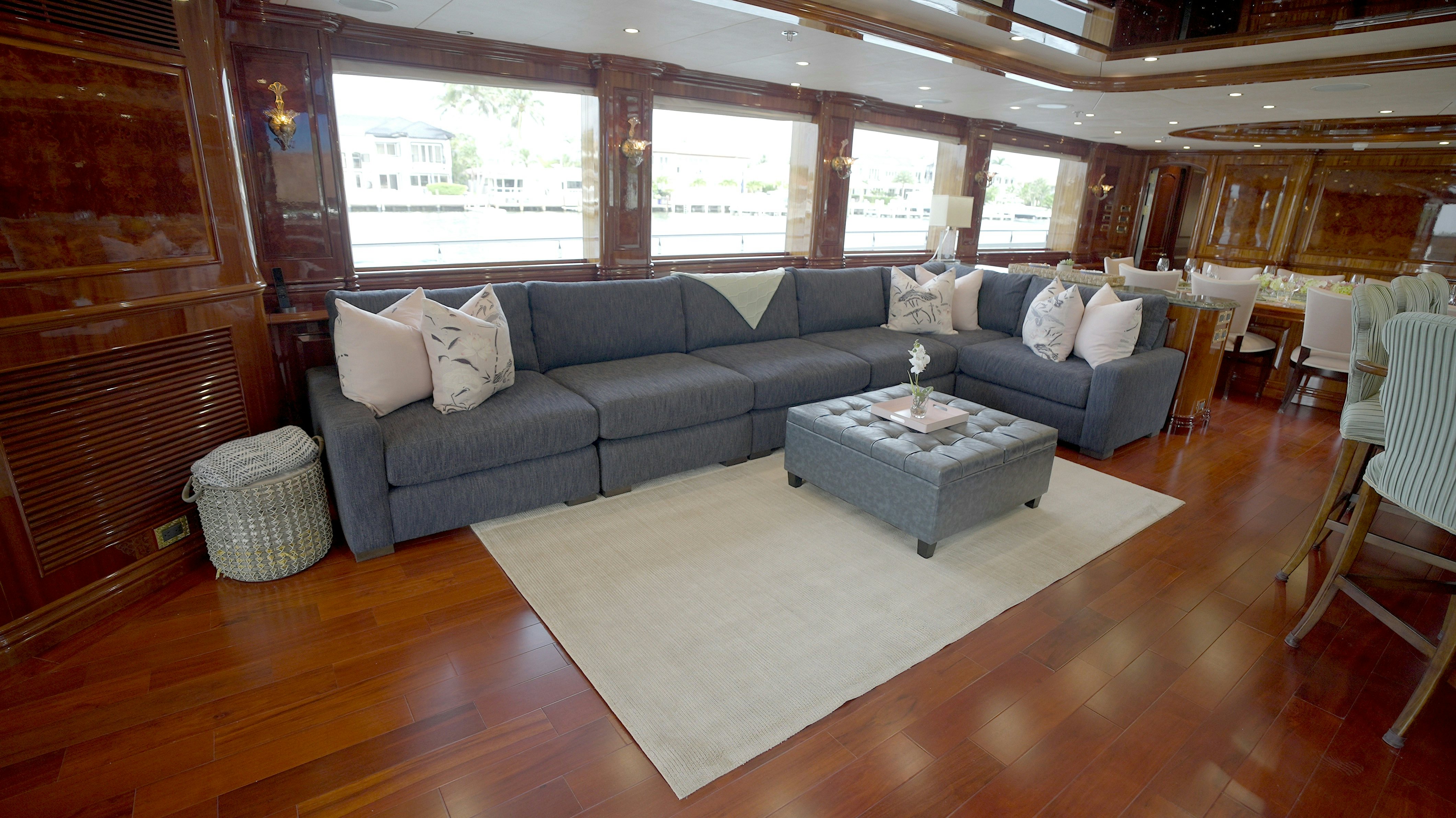 a living room with a couch and a table aboard HOMECOMING Yacht for Sale