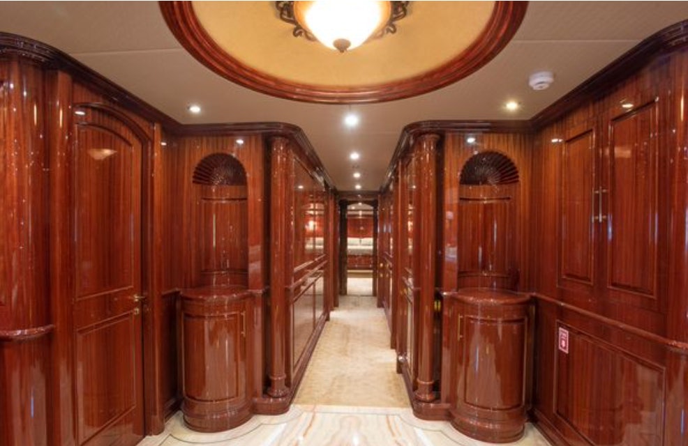 a room with wooden cabinets aboard HOMECOMING Yacht for Sale