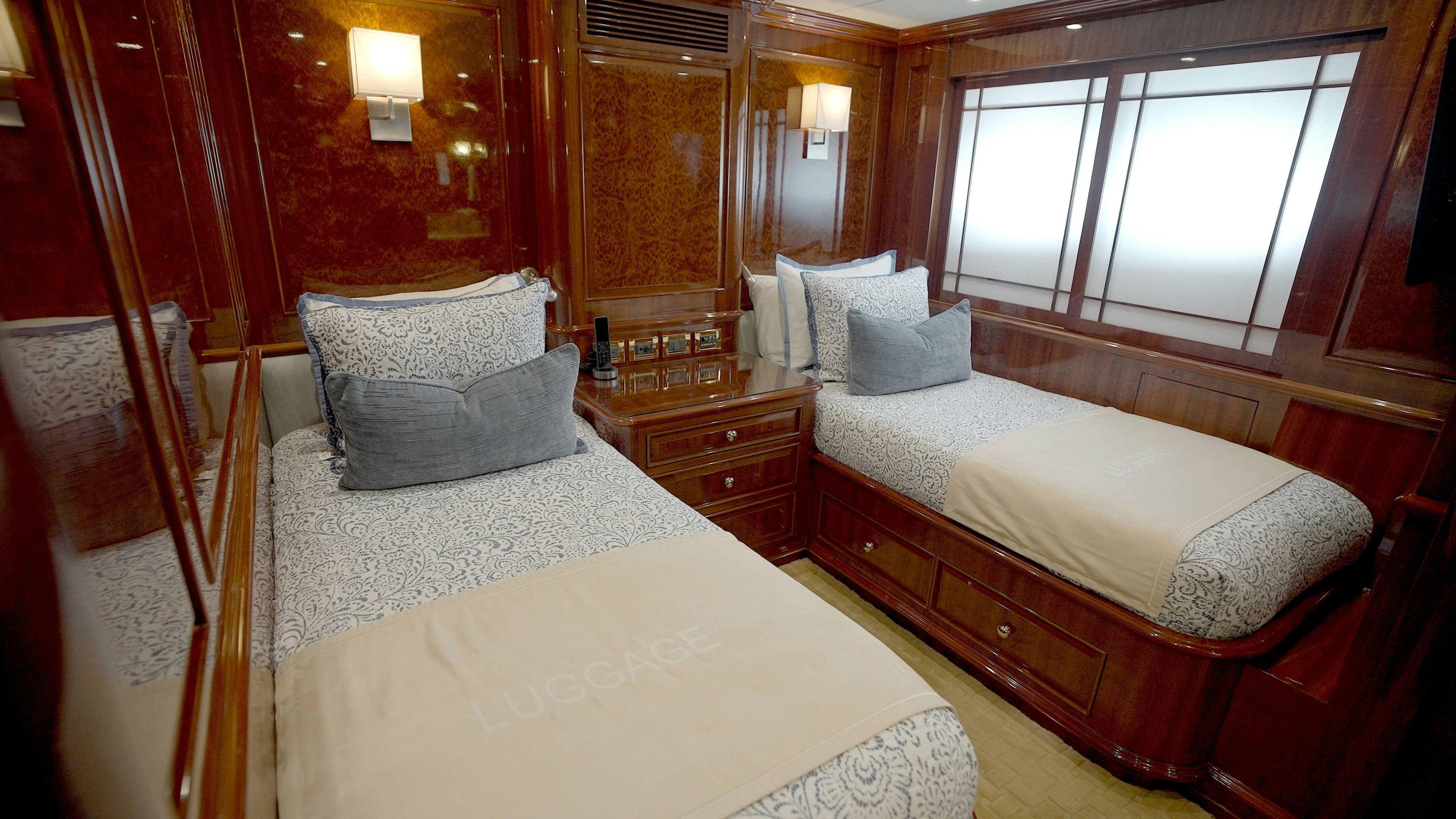 a couple of beds in a room aboard HOMECOMING Yacht for Sale