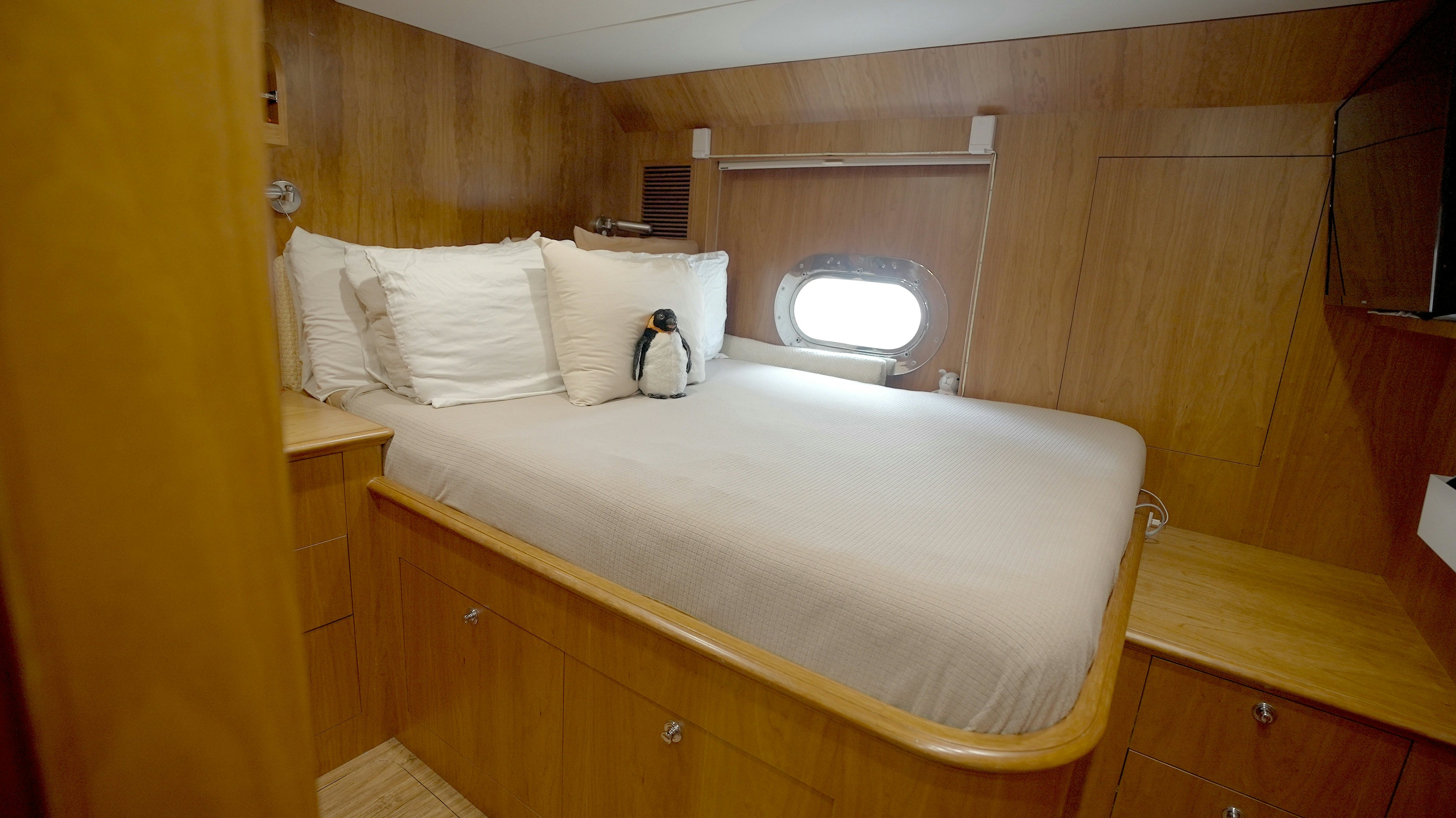 a bed with a white sheet aboard HOMECOMING Yacht for Sale