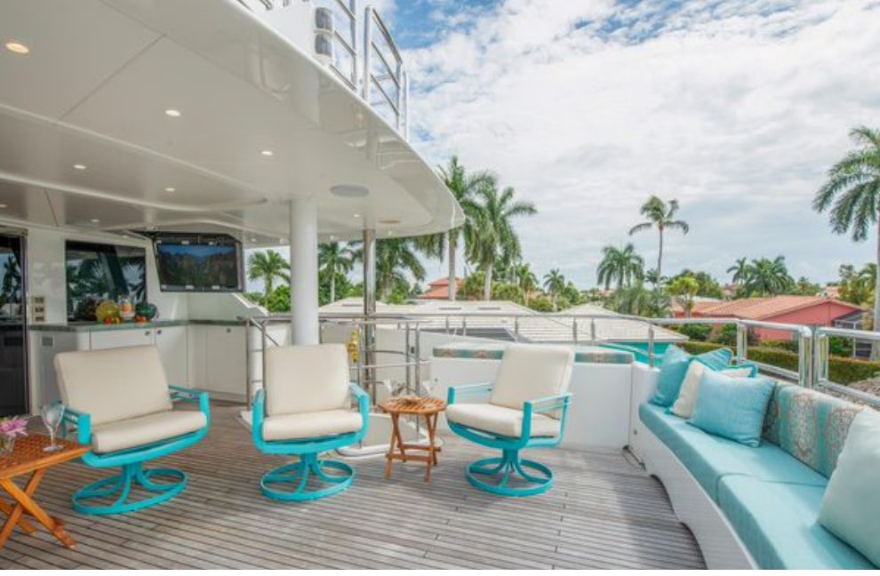 a large patio with a pool aboard HOMECOMING Yacht for Sale
