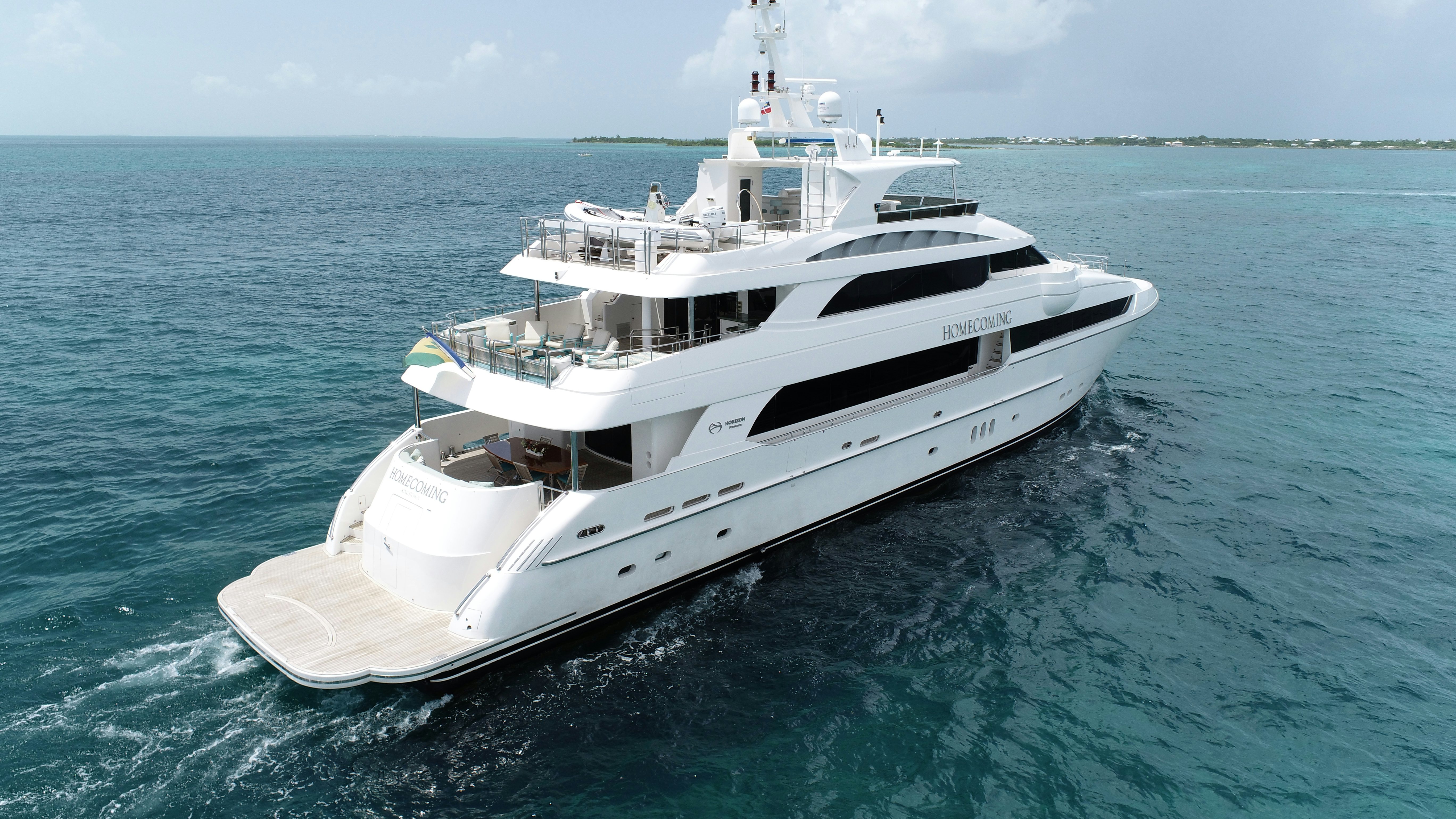 a white boat in the water aboard HOMECOMING Yacht for Sale