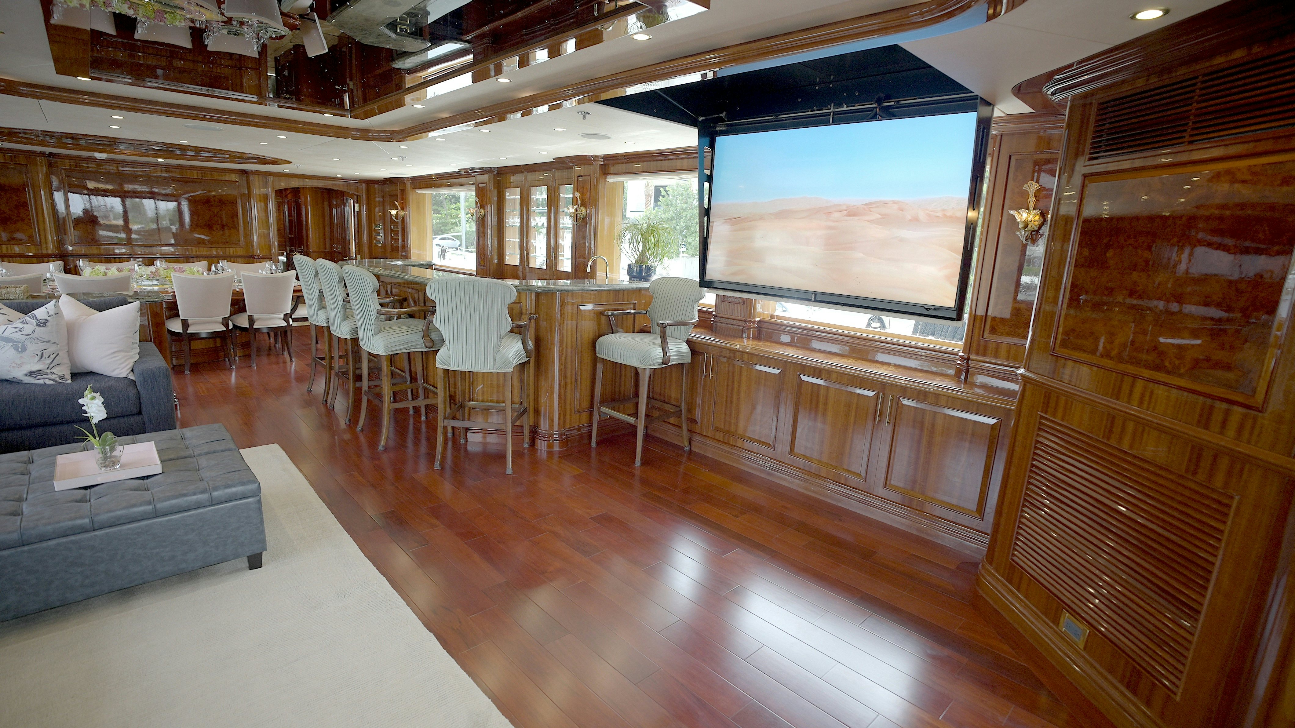 a room with a couch and a table and chairs aboard HOMECOMING Yacht for Sale
