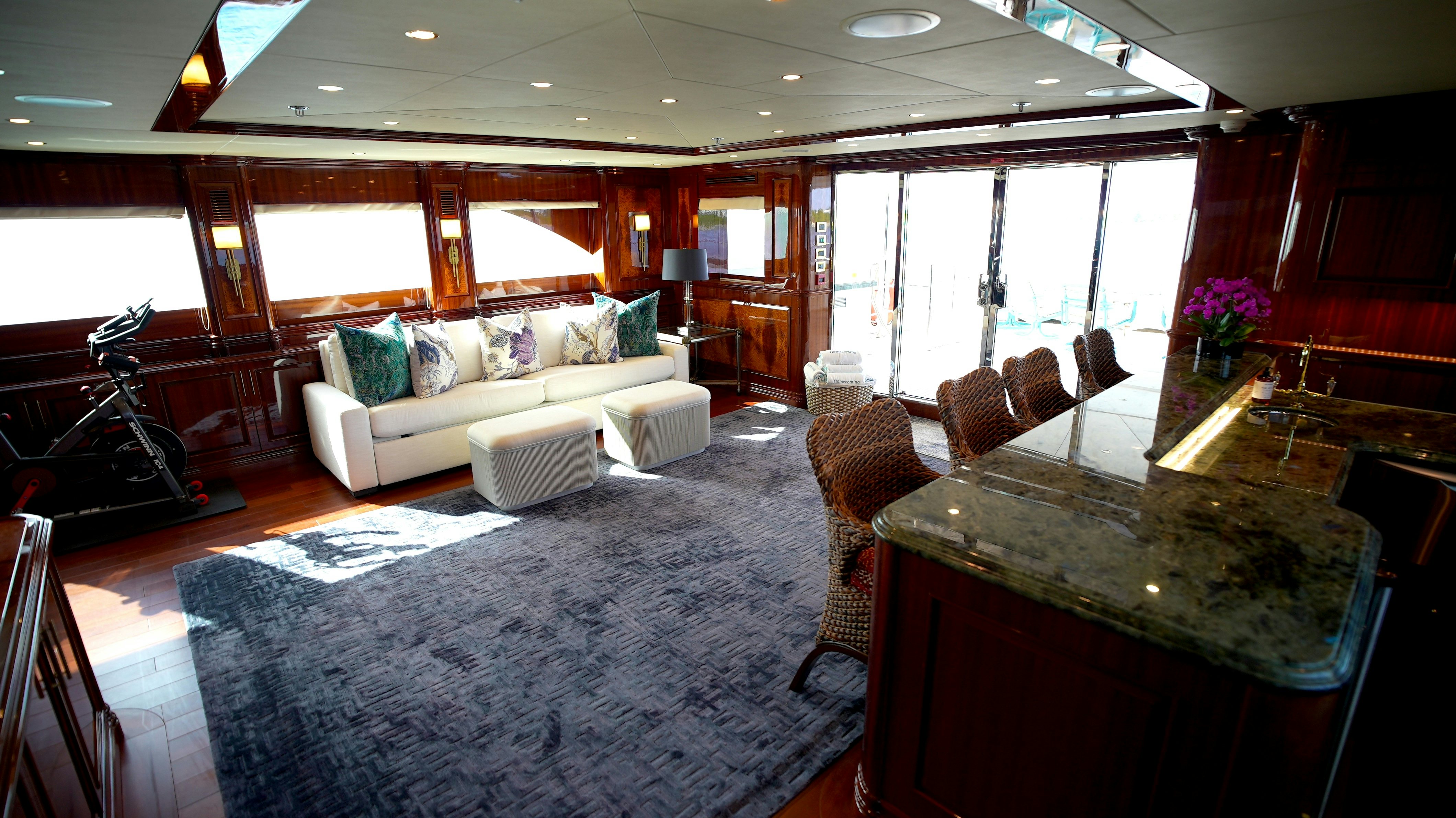 a living room with a large window aboard HOMECOMING Yacht for Sale