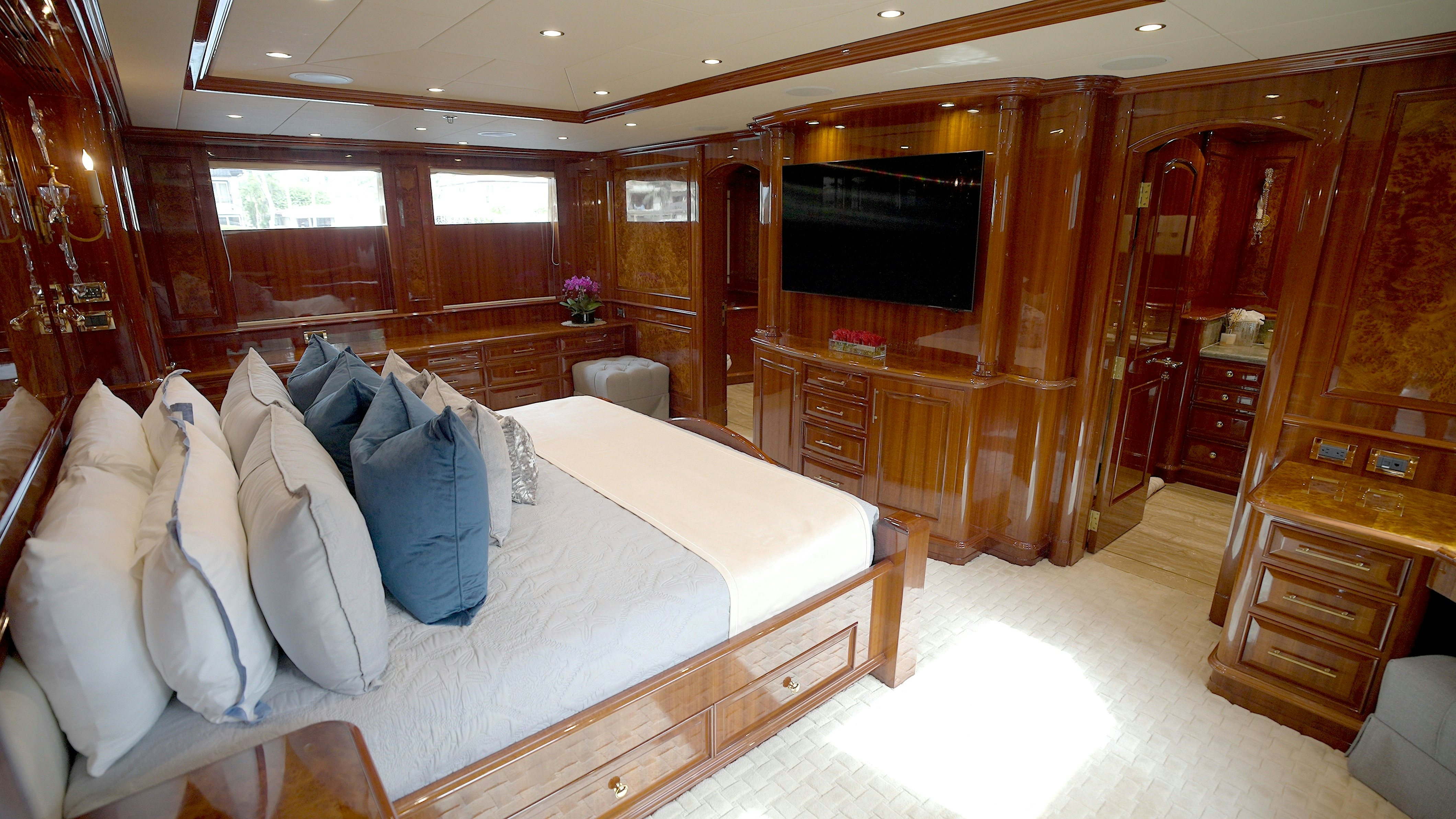 a large bed in a room aboard HOMECOMING Yacht for Sale