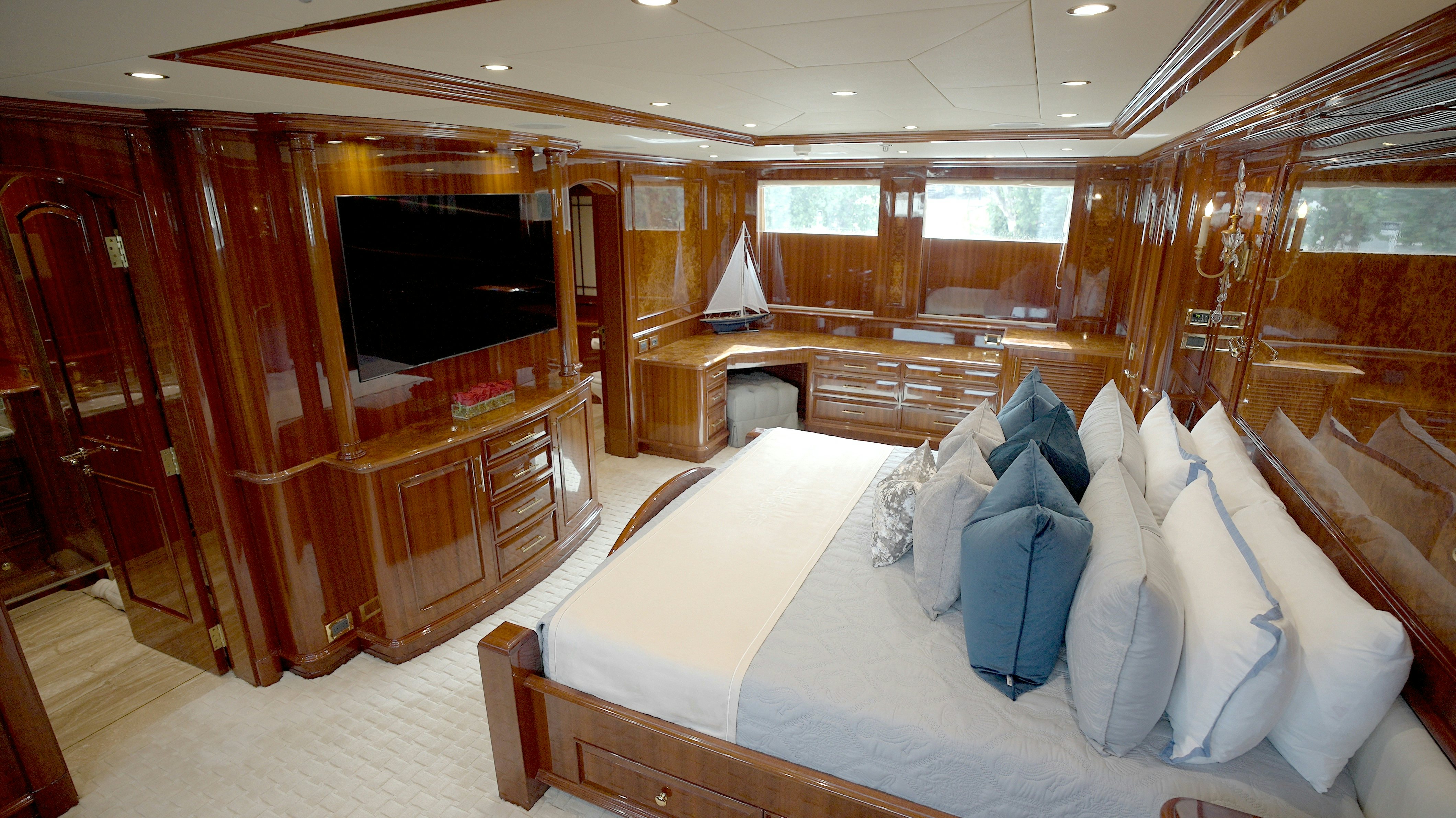 a large living room with a large mirror aboard HOMECOMING Yacht for Sale