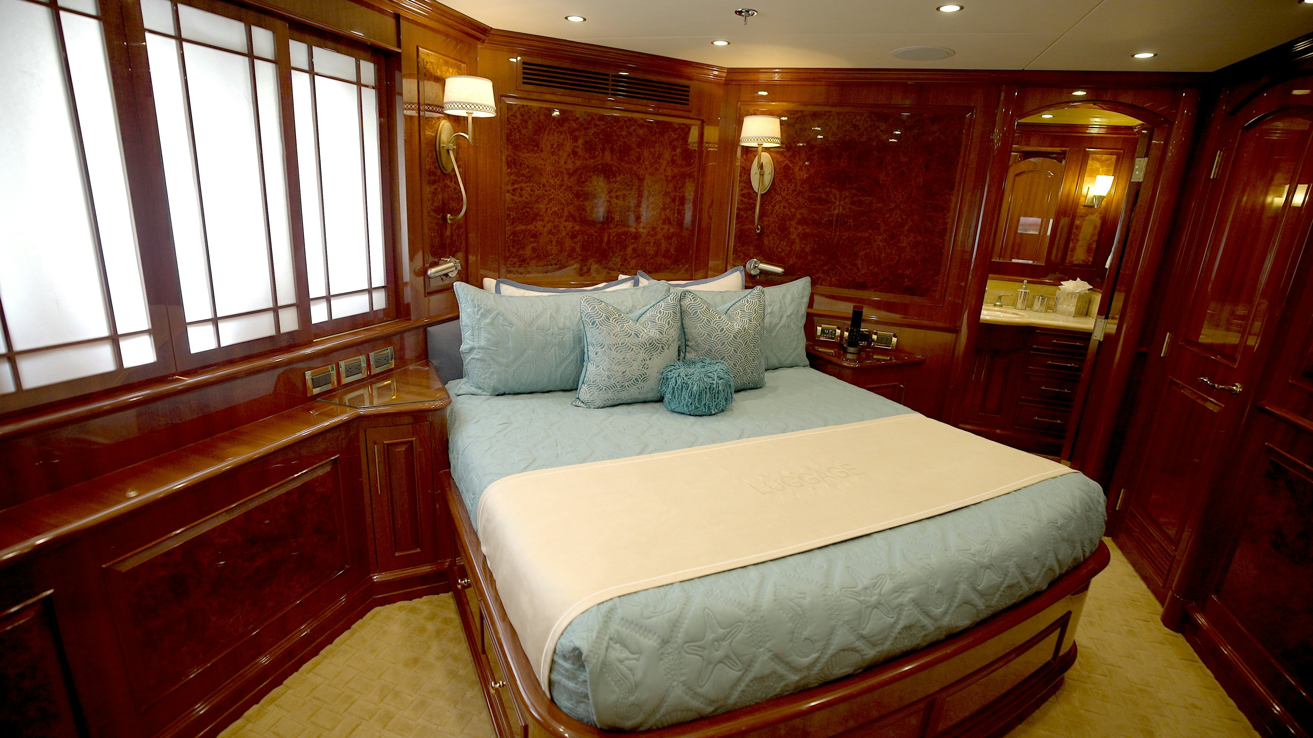 a bed in a room aboard HOMECOMING Yacht for Sale