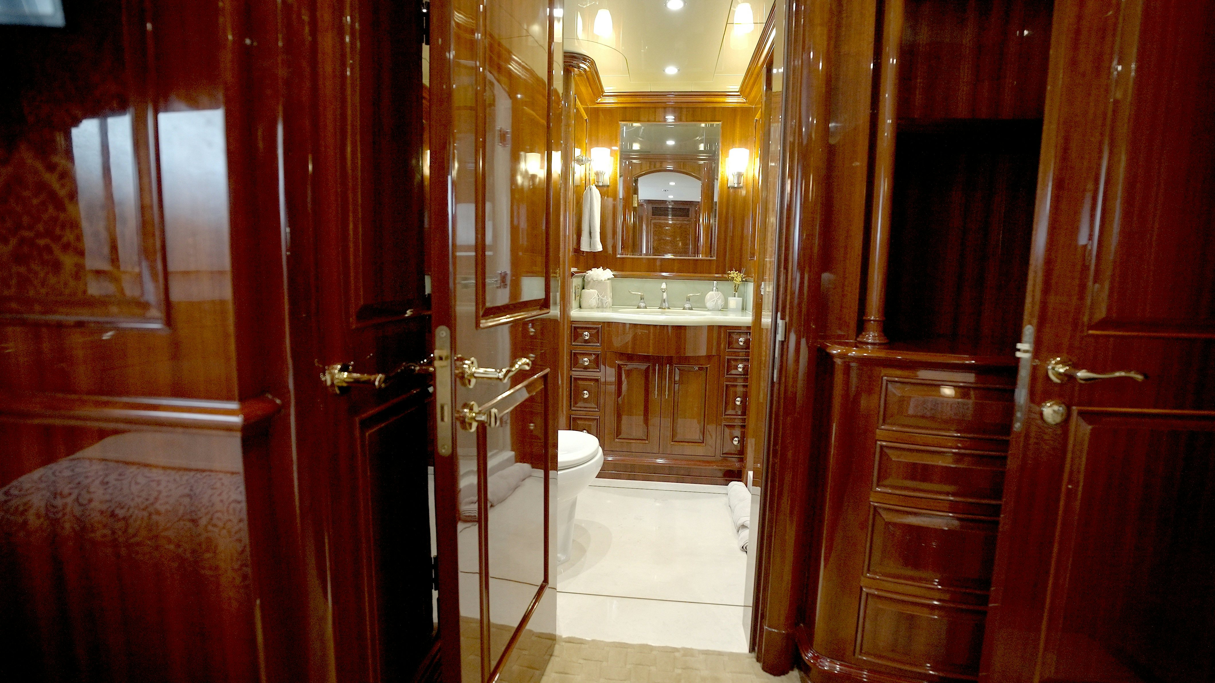 a bathroom with a large mirror aboard HOMECOMING Yacht for Sale