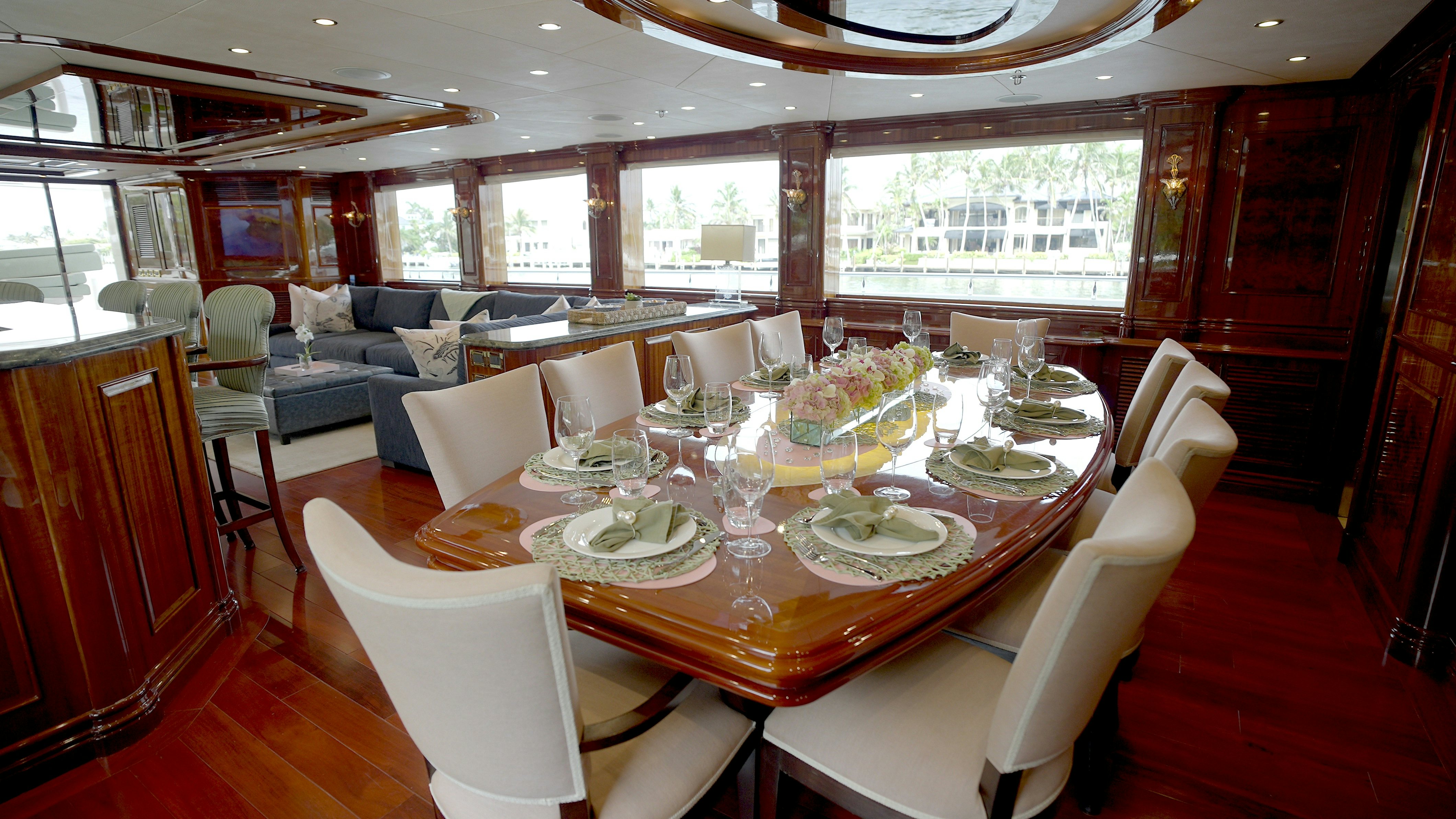 a dining room with a table set for a meal aboard HOMECOMING Yacht for Sale