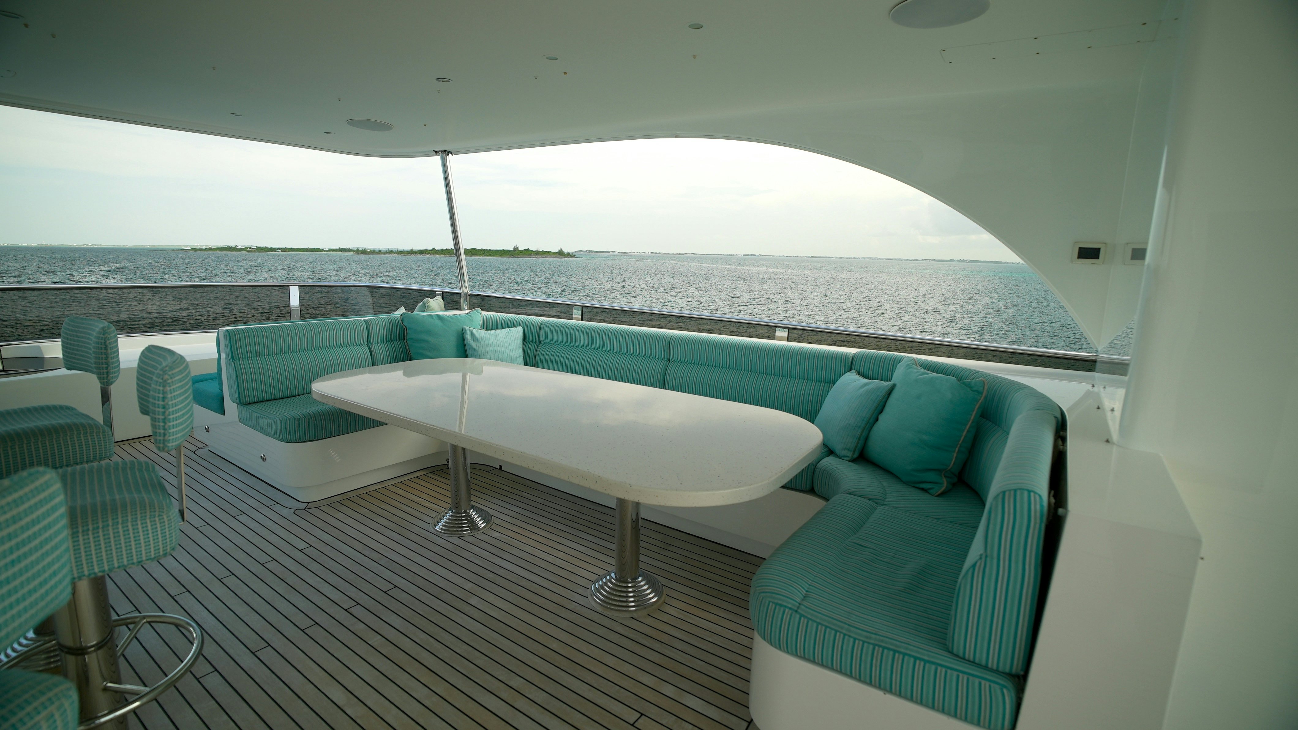 a room with a table and chairs aboard HOMECOMING Yacht for Sale