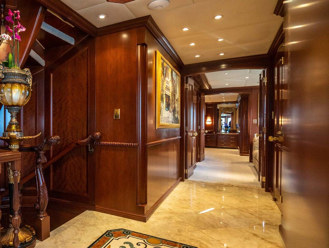 a hallway with wood cabinets aboard RELENTLESS Yacht for Charter
