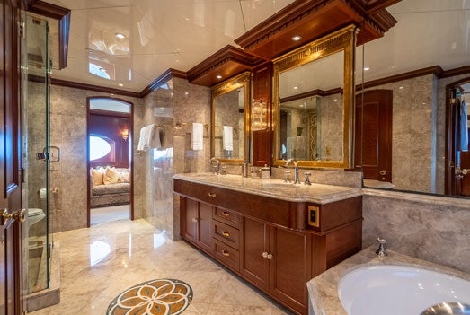 a bathroom with a large mirror aboard RELENTLESS Yacht for Charter