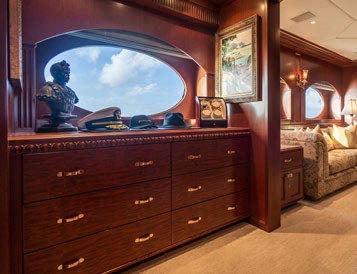 a dresser in a room aboard RELENTLESS Yacht for Charter