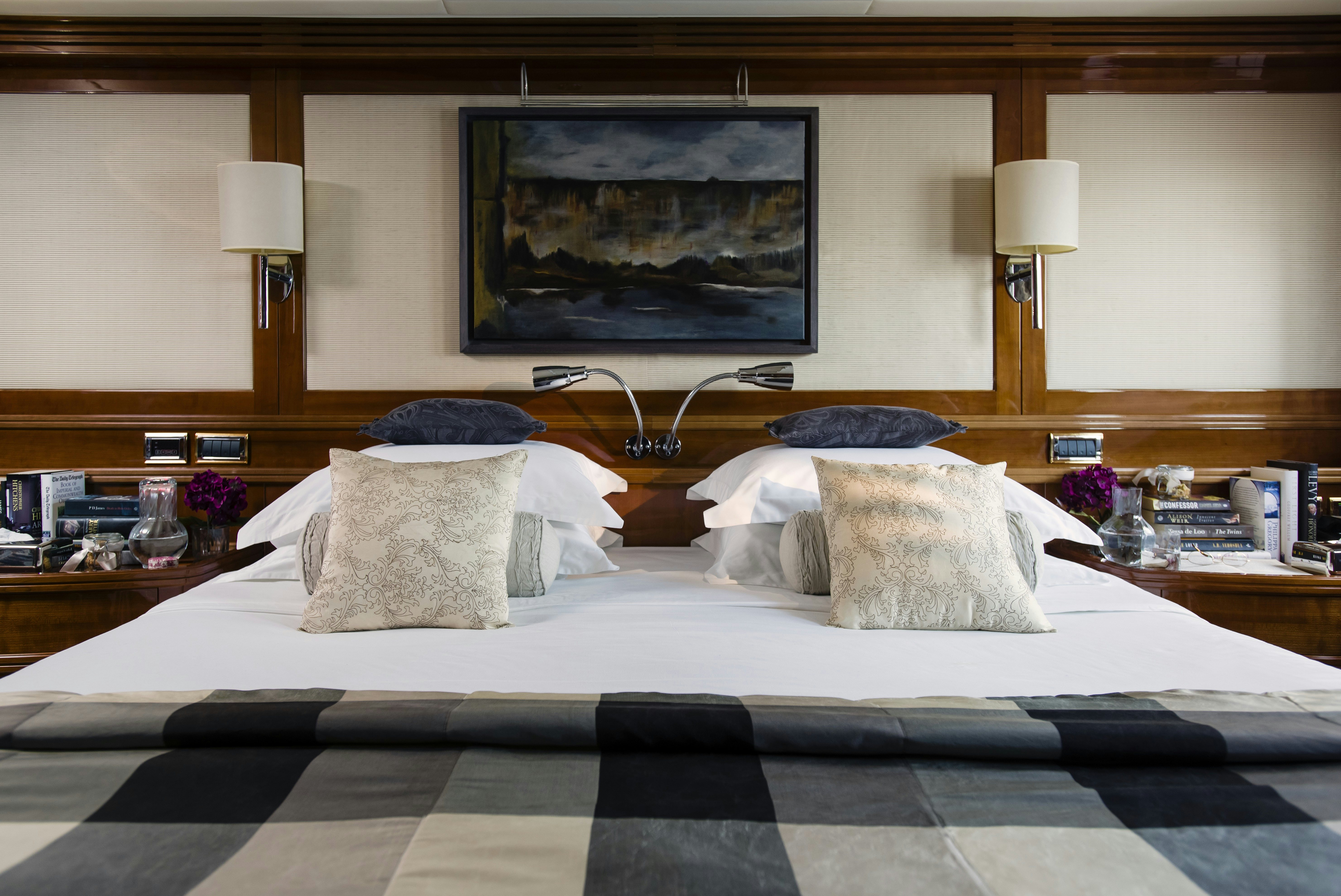 a bed with pillows and pillows aboard METSUYAN IV Yacht for Charter