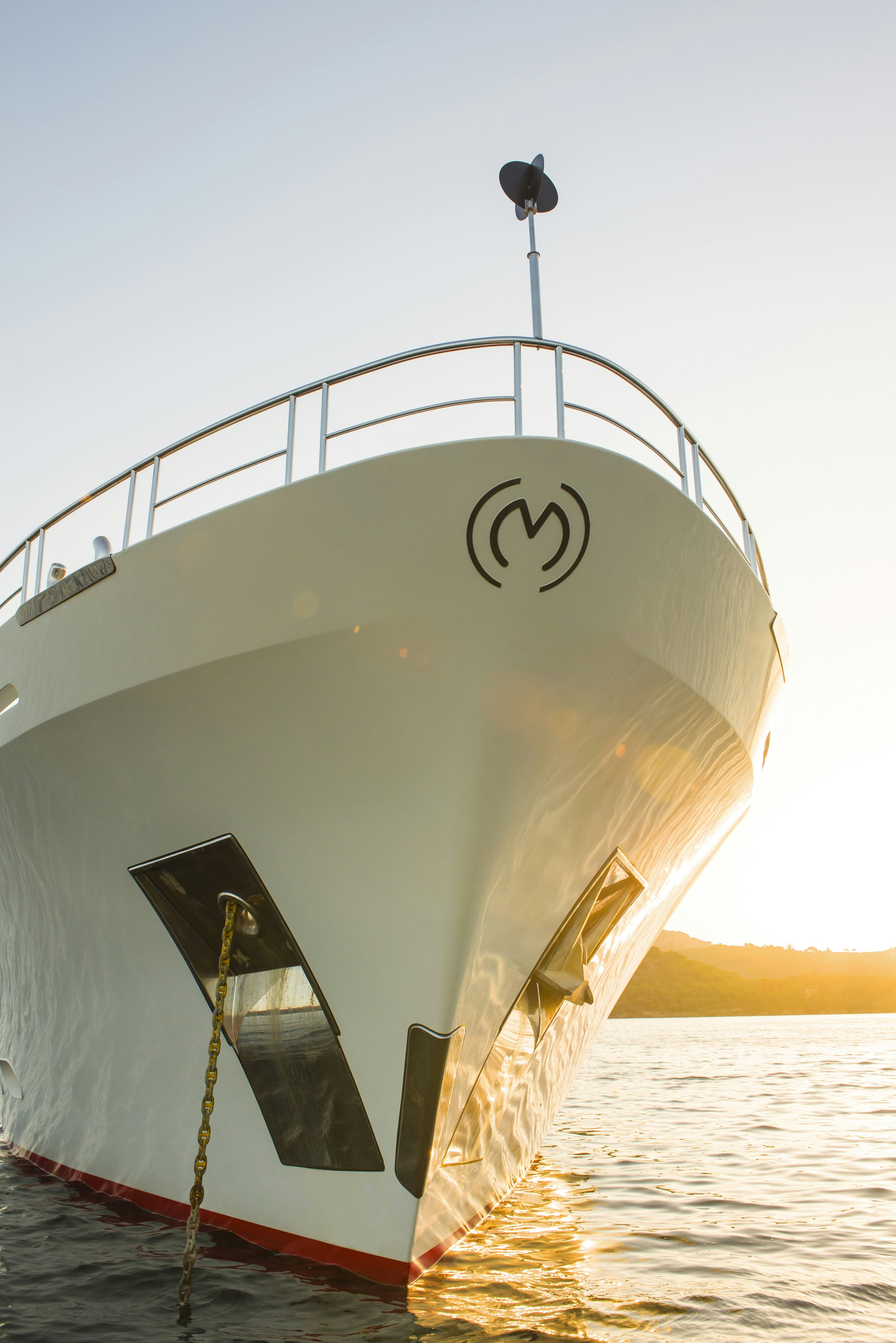 a large white boat with a rope attached to it aboard METSUYAN IV Yacht for Charter