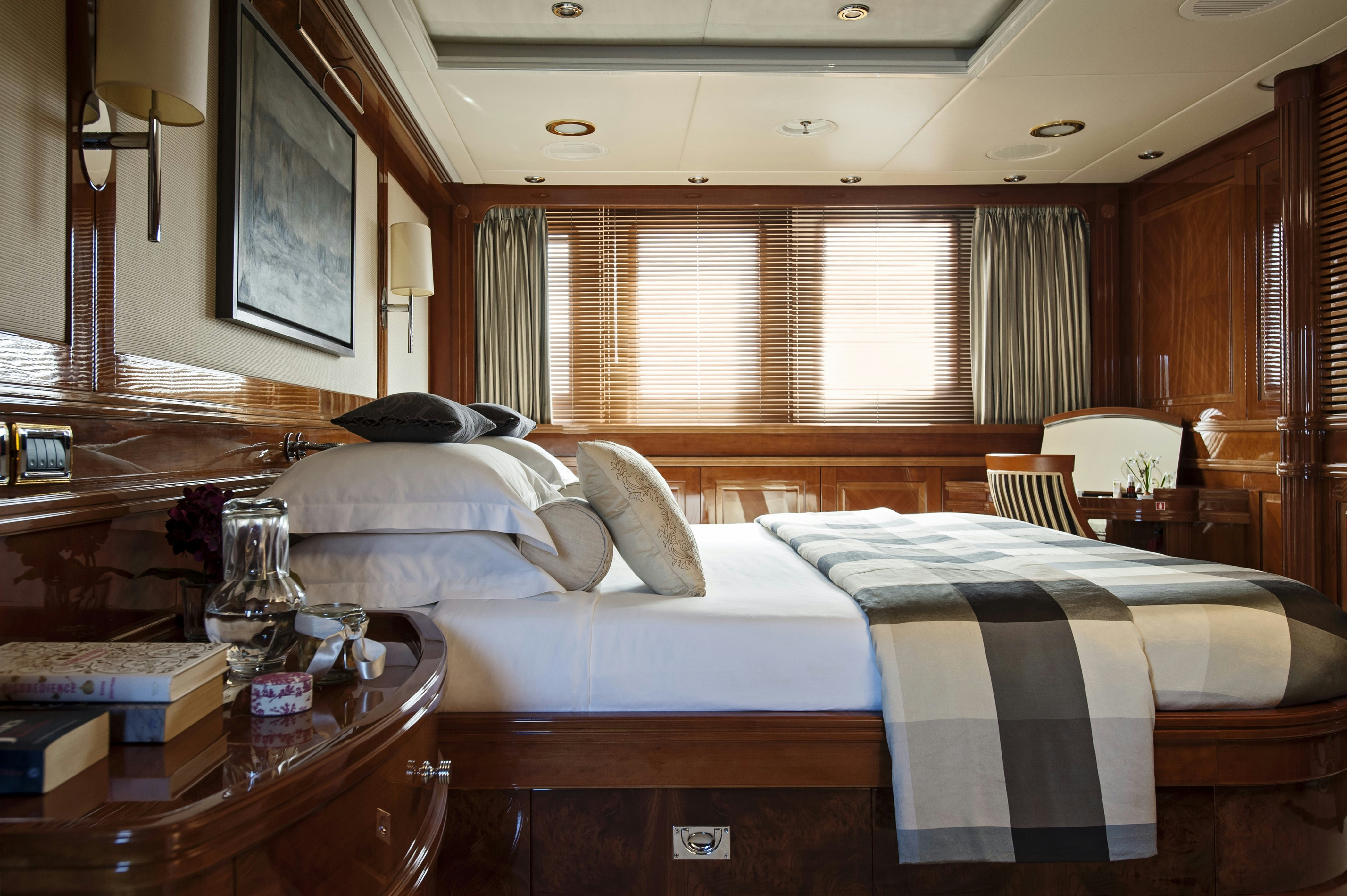 a bedroom with two beds aboard METSUYAN IV Yacht for Charter