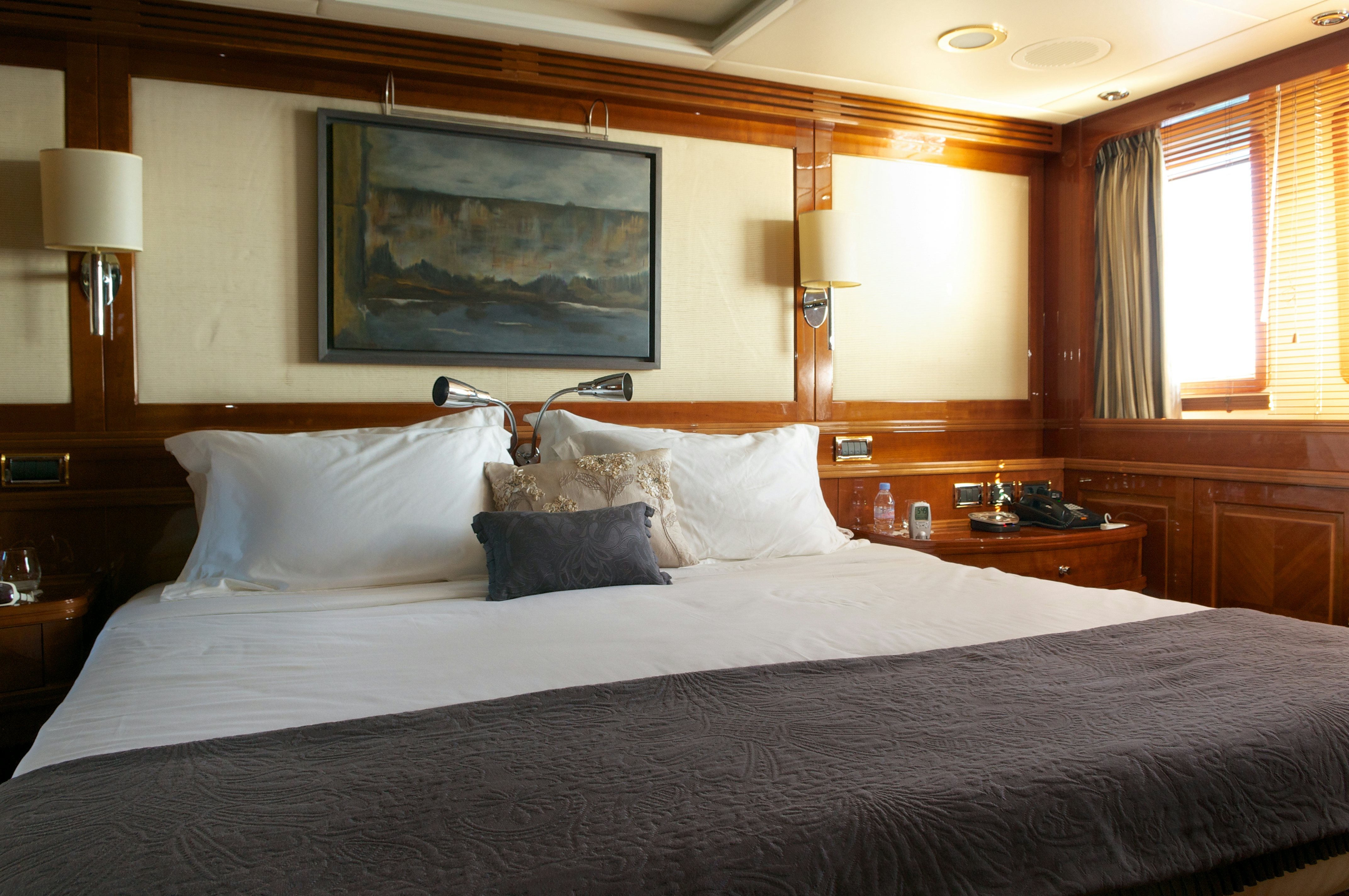 a large bed with a large mirror above it aboard METSUYAN IV Yacht for Charter
