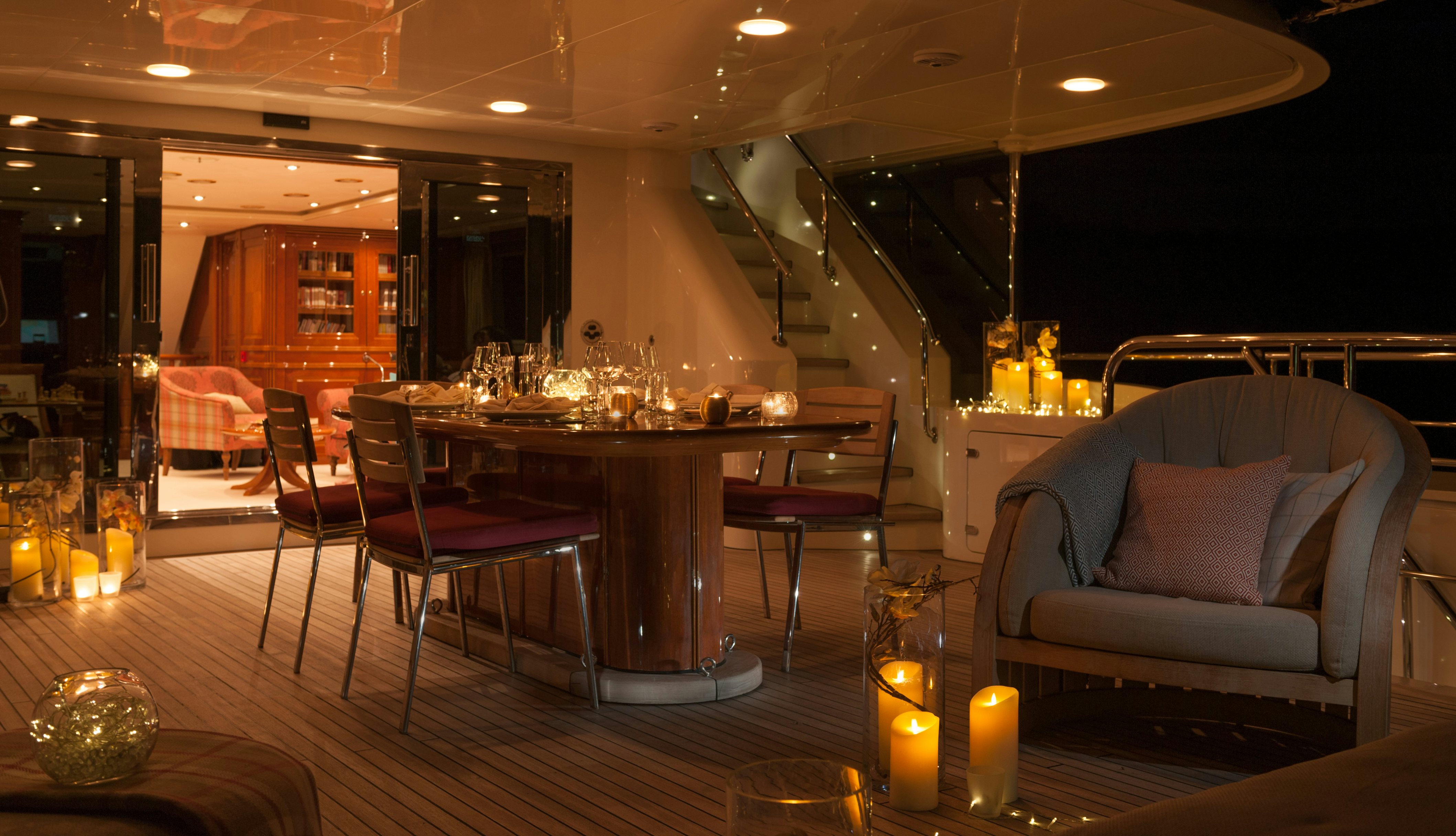 a room with a table and chairs aboard METSUYAN IV Yacht for Charter