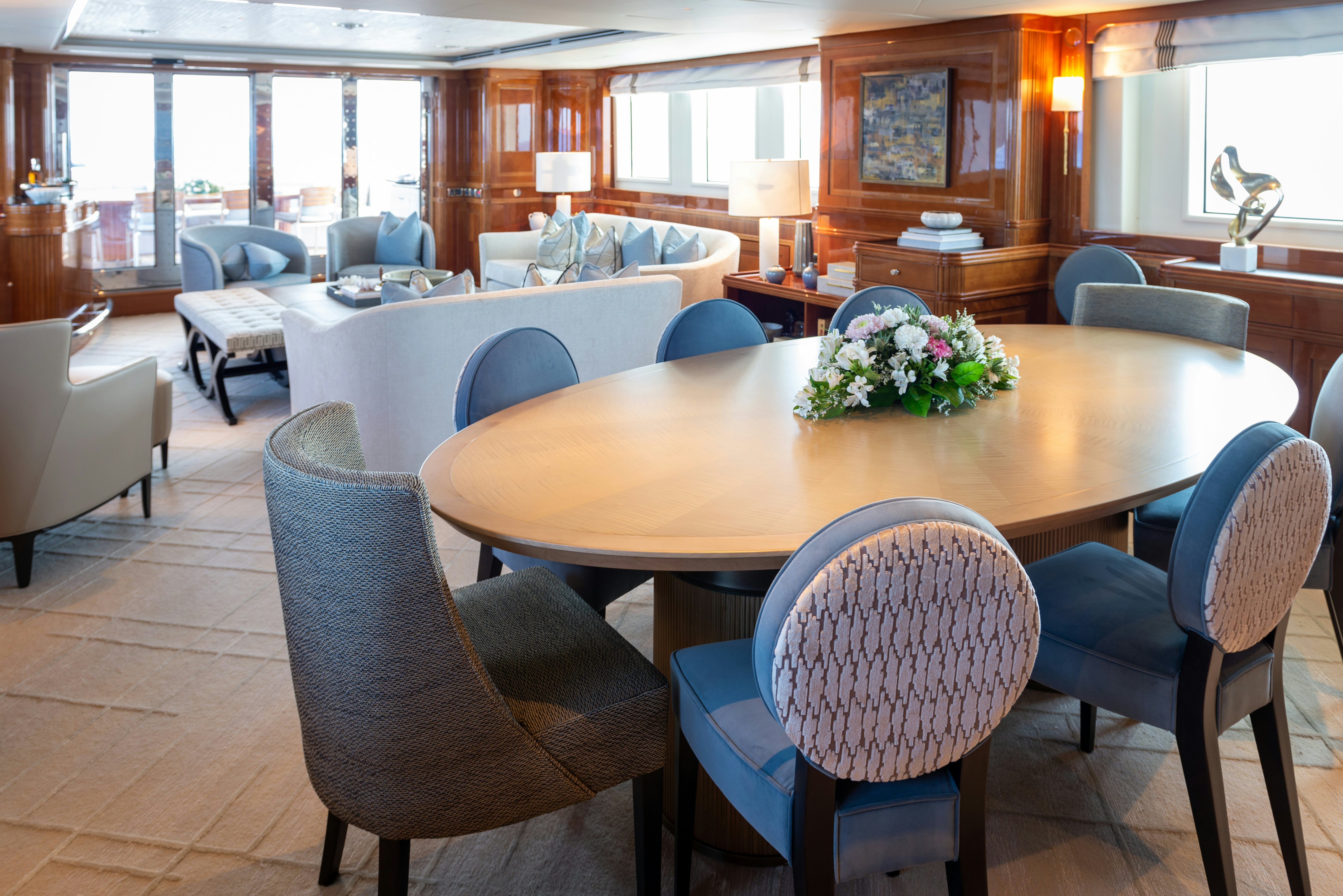 a dining room with a table and chairs aboard METSUYAN IV Yacht for Charter