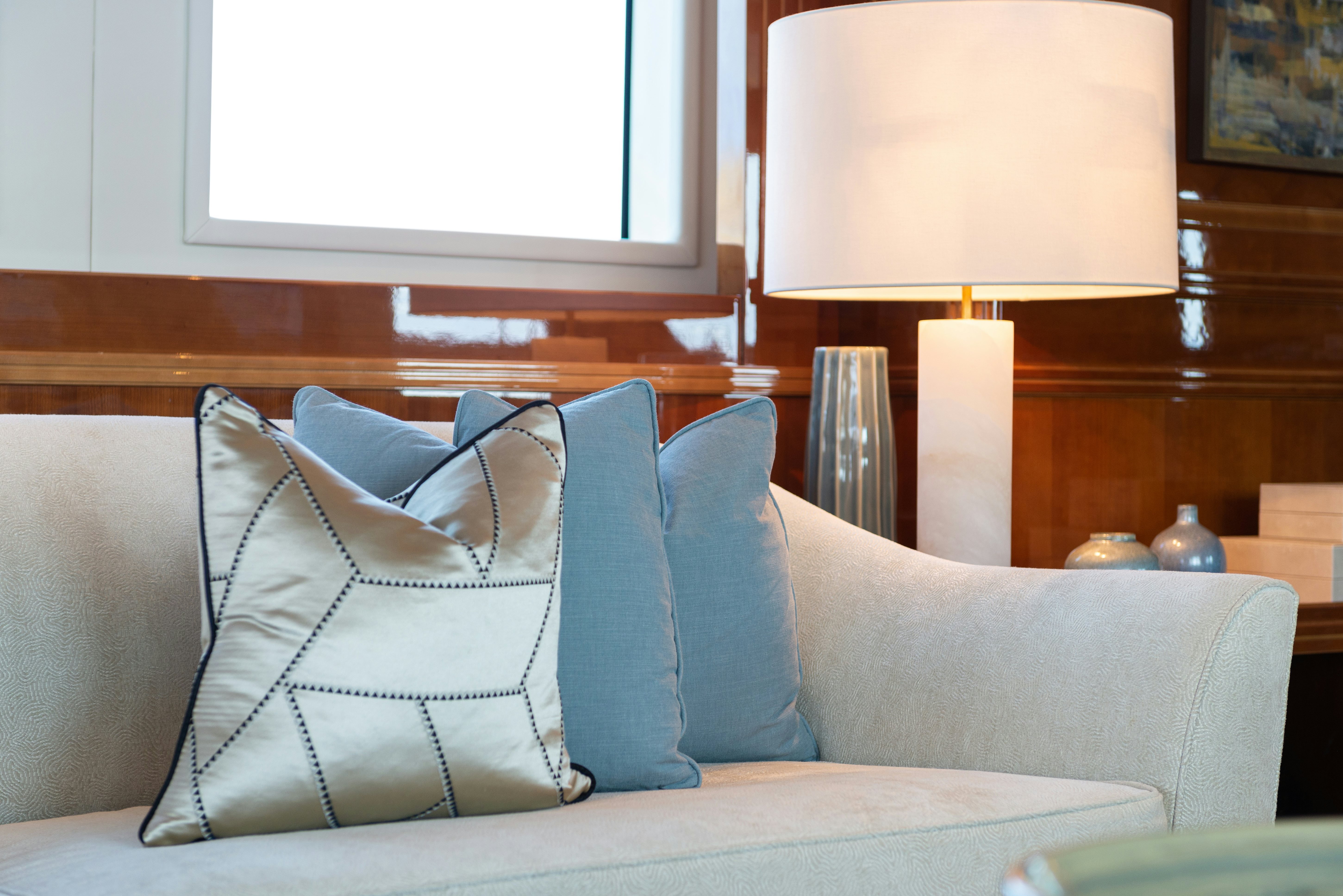 a couch with pillows on it aboard METSUYAN IV Yacht for Charter
