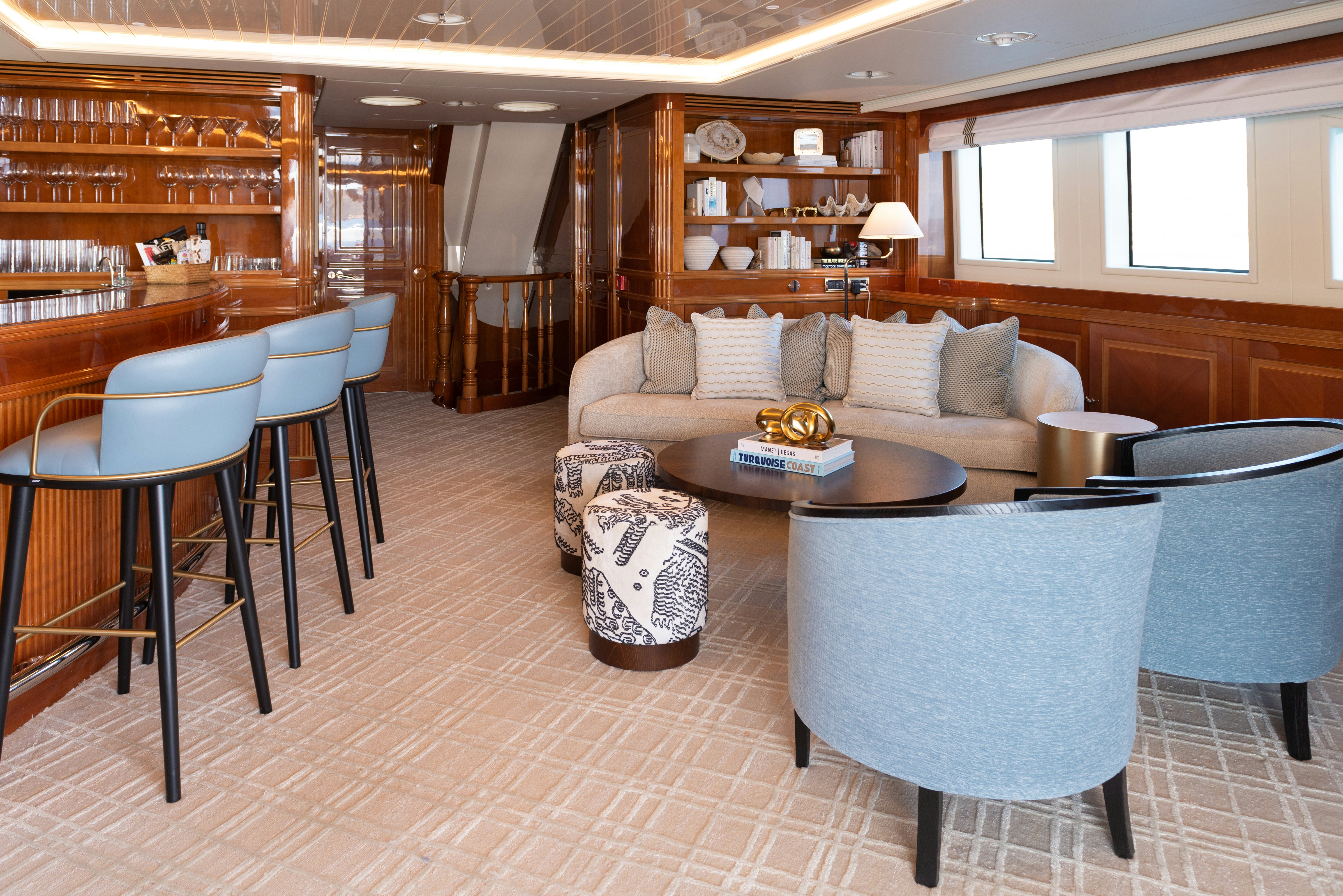 a living room with a couch and a table aboard METSUYAN IV Yacht for Charter