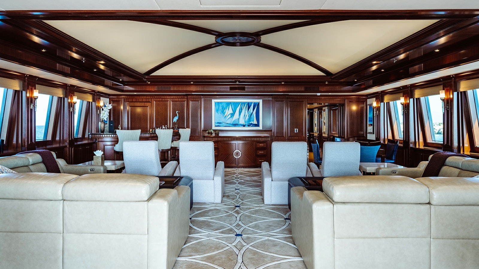 a room with a couch and a television on the wall aboard LADY BETH Yacht for Charter