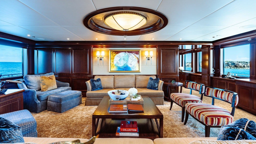 a living room with a large window aboard LADY BETH Yacht for Charter