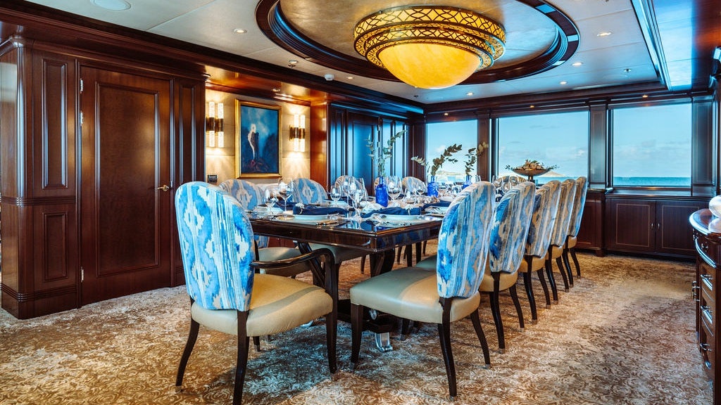 a dining room with a table and chairs aboard LADY BETH Yacht for Charter