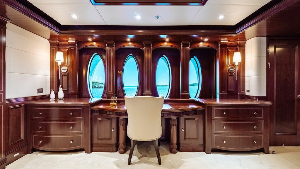 a room with a desk and chairs aboard LADY BETH Yacht for Charter