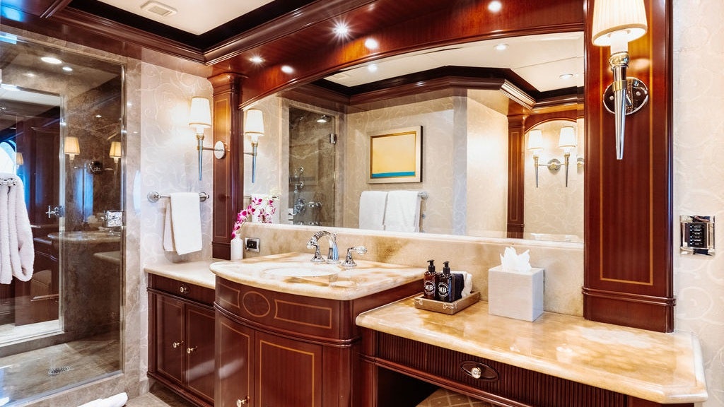 a bathroom with a large mirror aboard LADY BETH Yacht for Charter