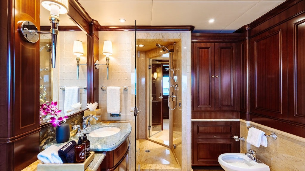 a bathroom with a sink and a mirror aboard LADY BETH Yacht for Charter