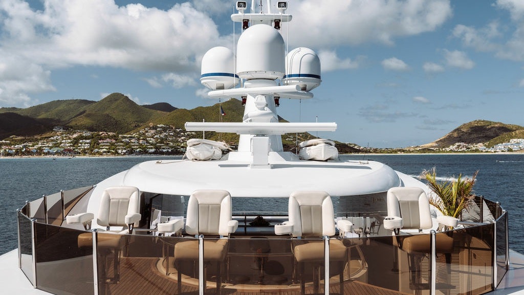 a boat with white chairs on it aboard LADY BETH Yacht for Charter