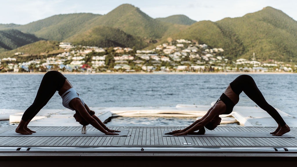 a person doing yoga on a dock aboard LADY BETH Yacht for Charter
