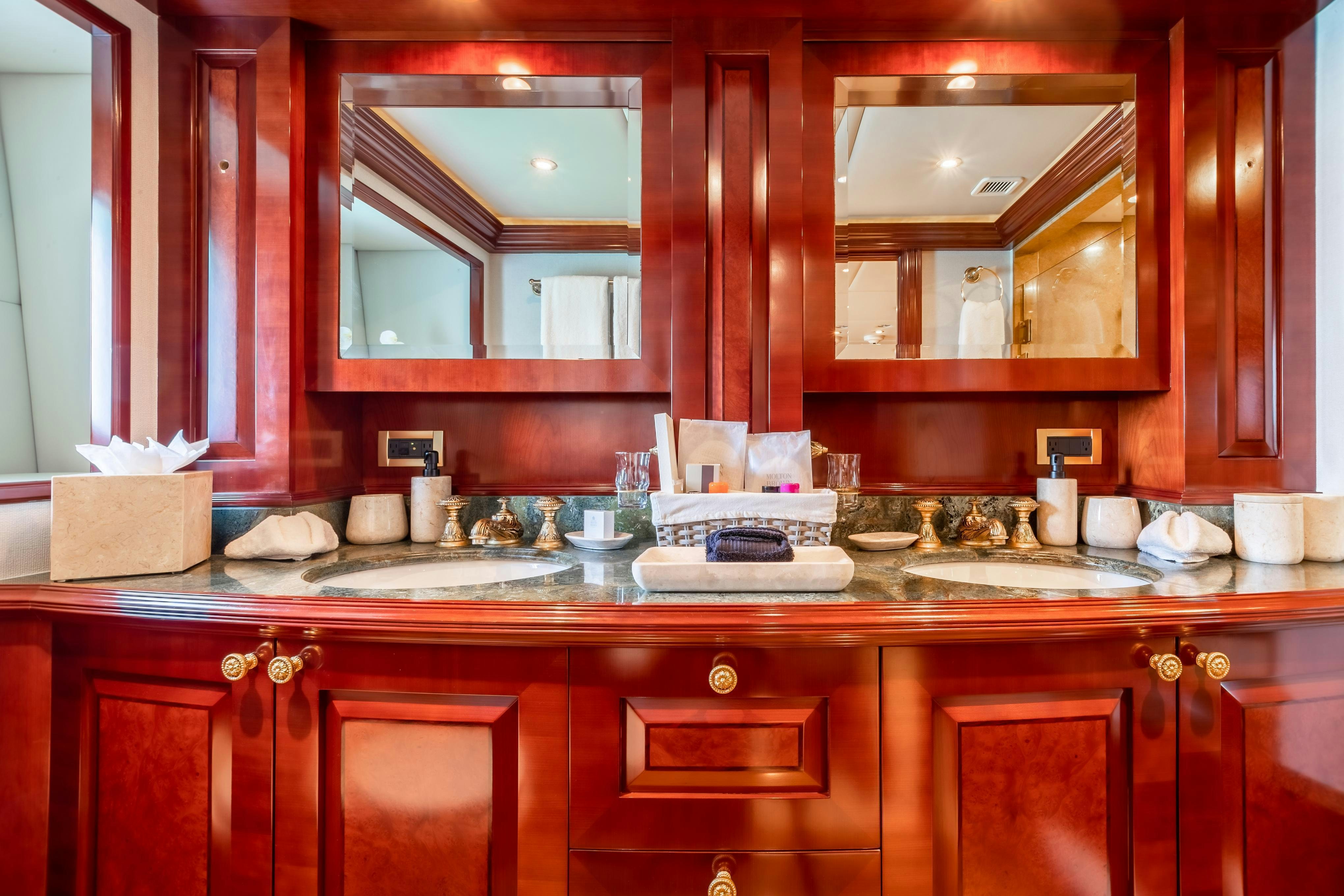 a kitchen with wooden cabinets aboard TCB Yacht for Charter