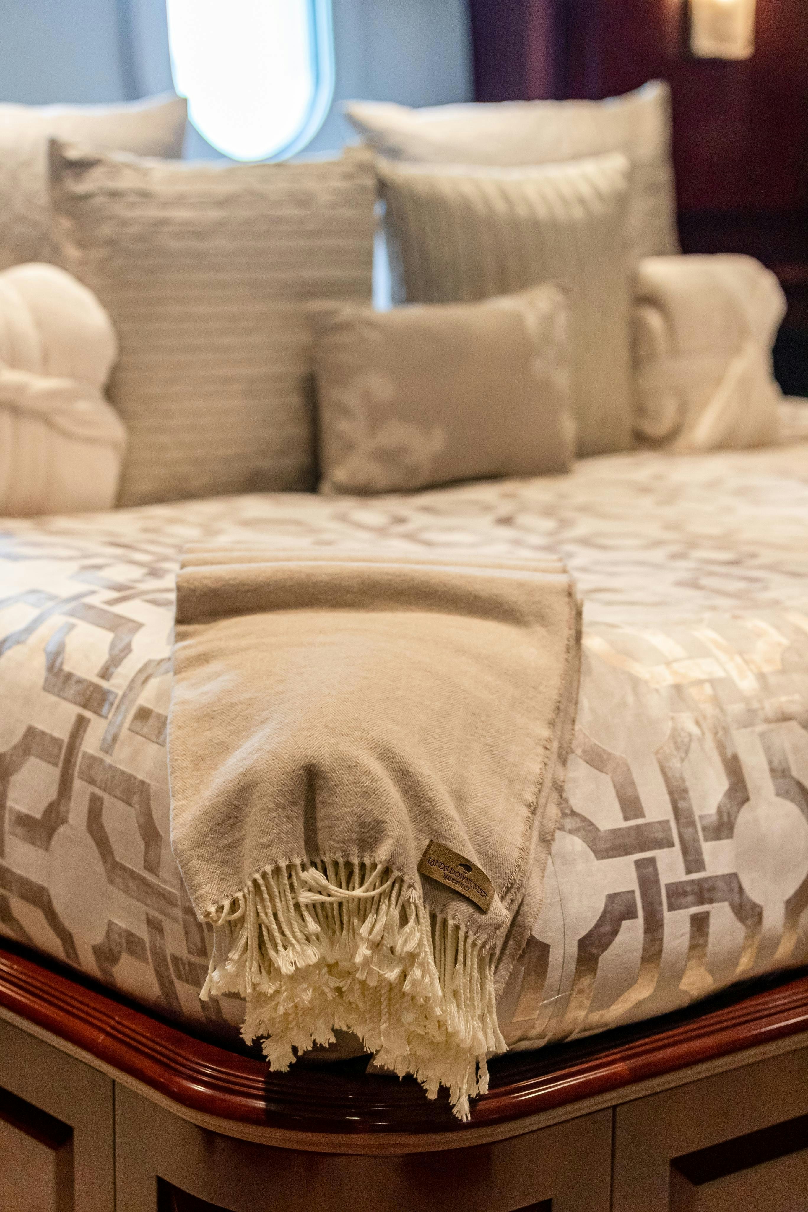 a couch with pillows on it aboard TCB Yacht for Charter