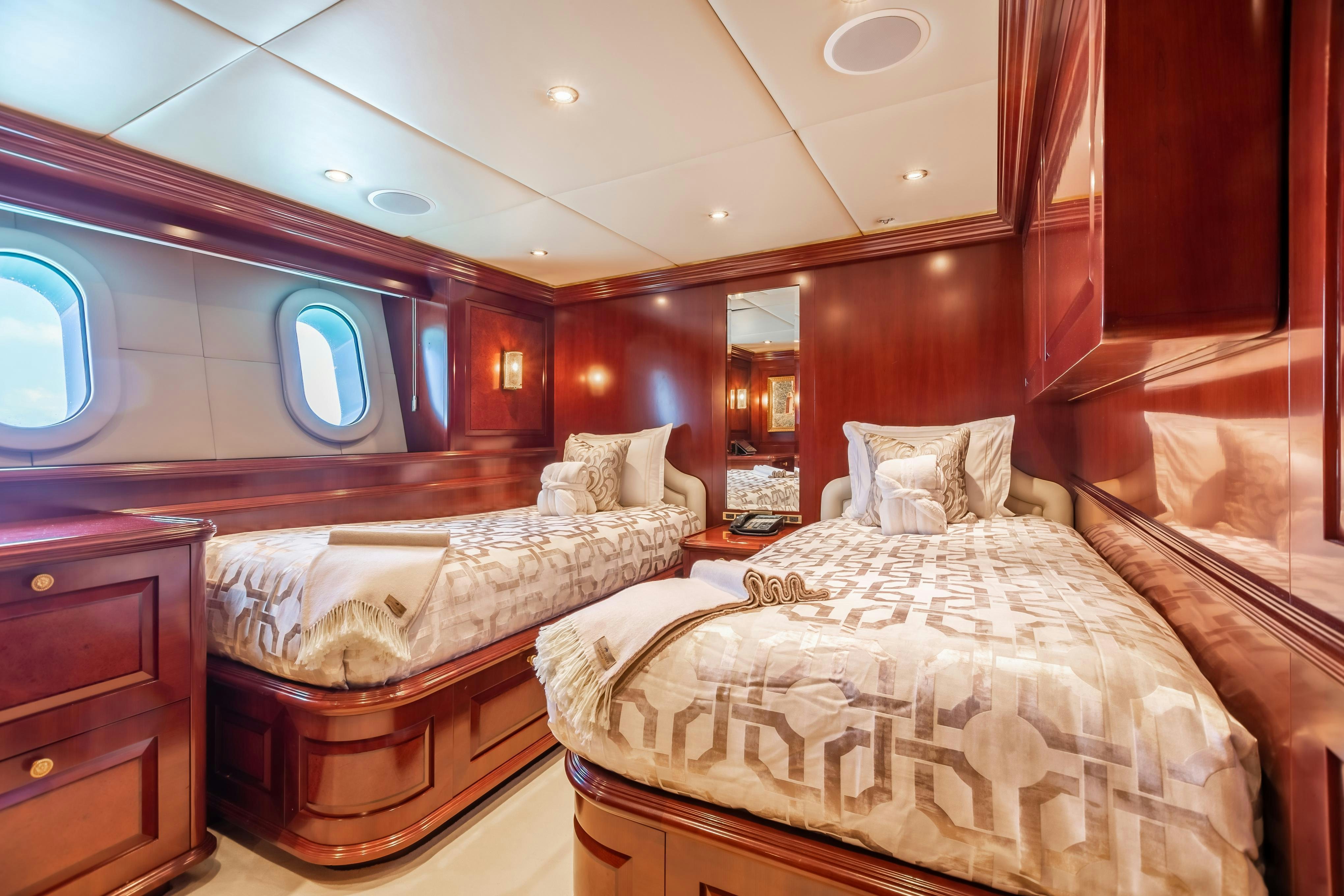 a room with two beds aboard TCB Yacht for Charter