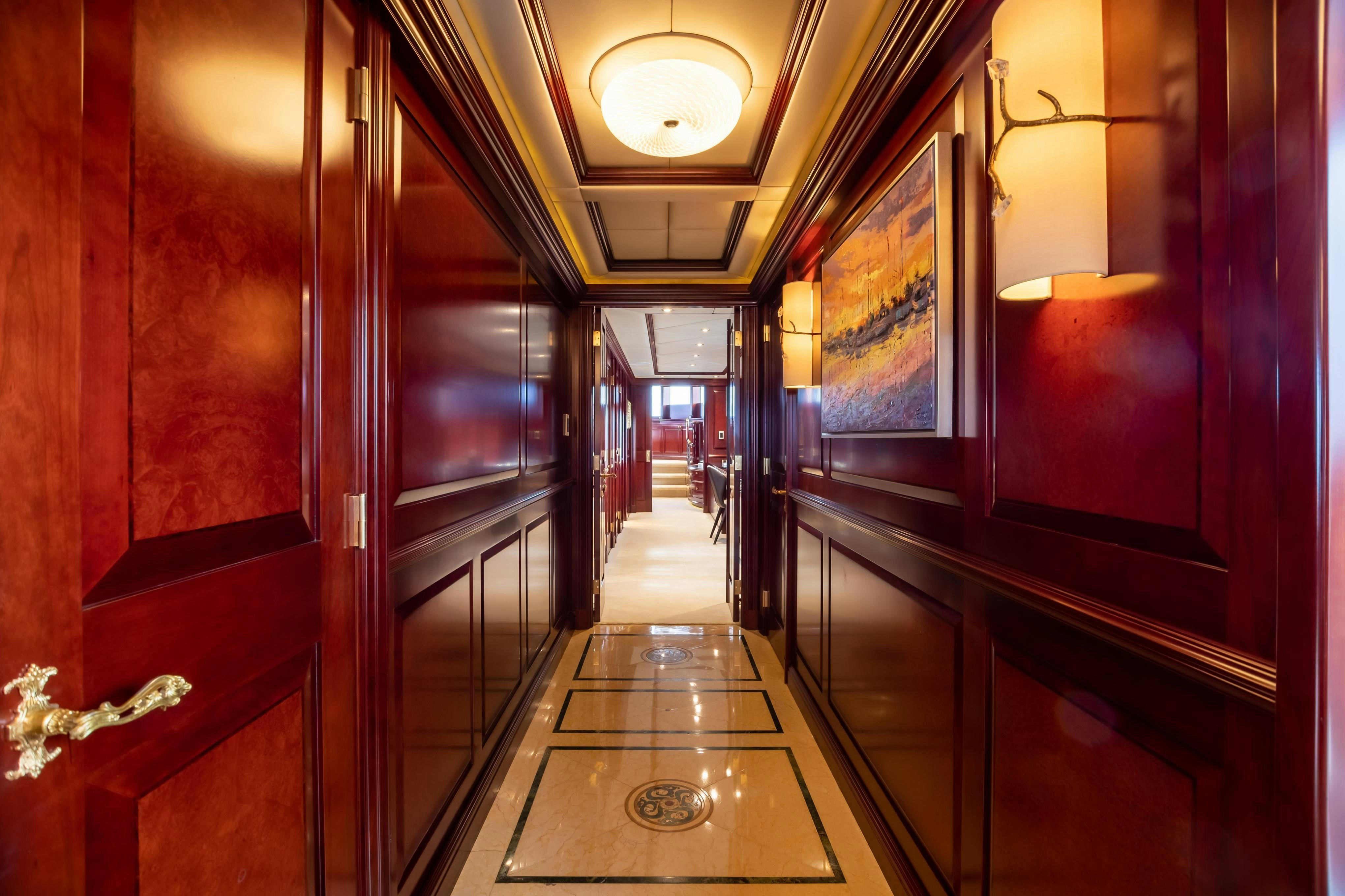 a hallway with red doors aboard TCB Yacht for Charter