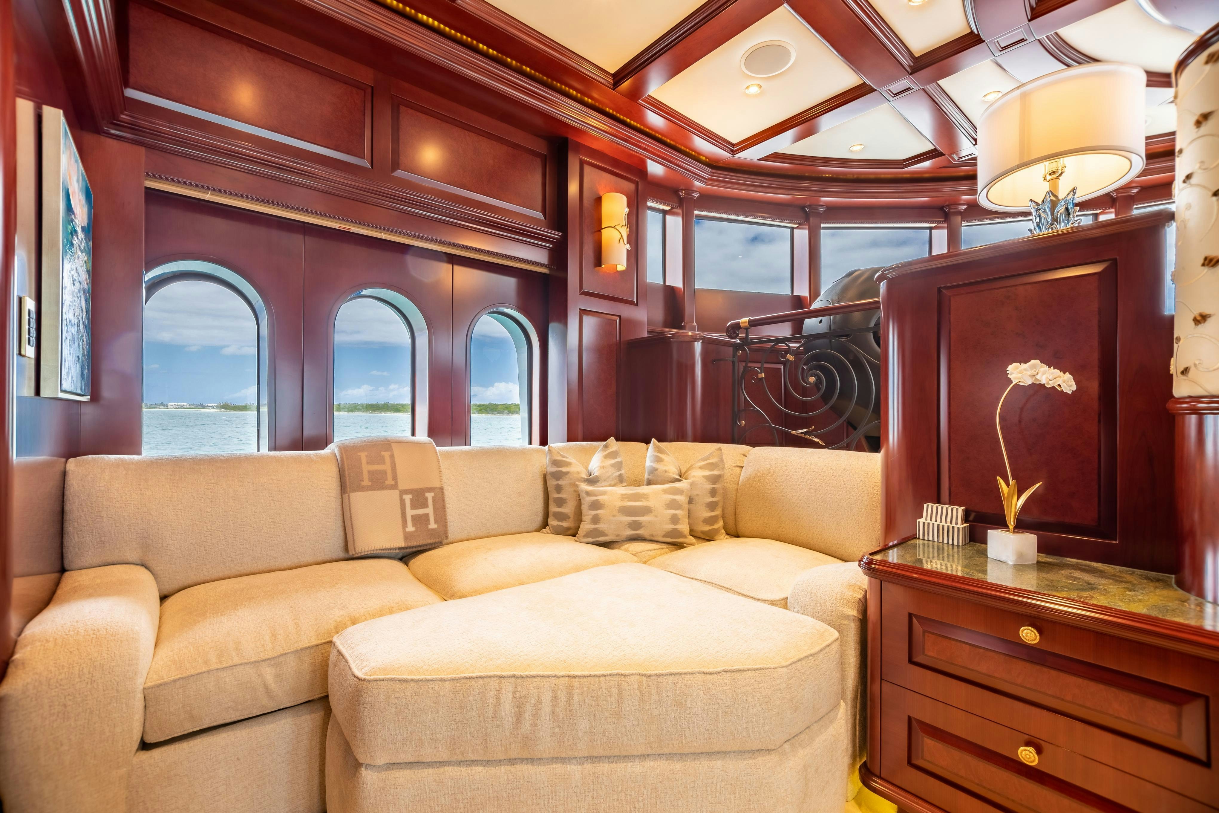 a living room with a couch and a fireplace aboard TCB Yacht for Charter