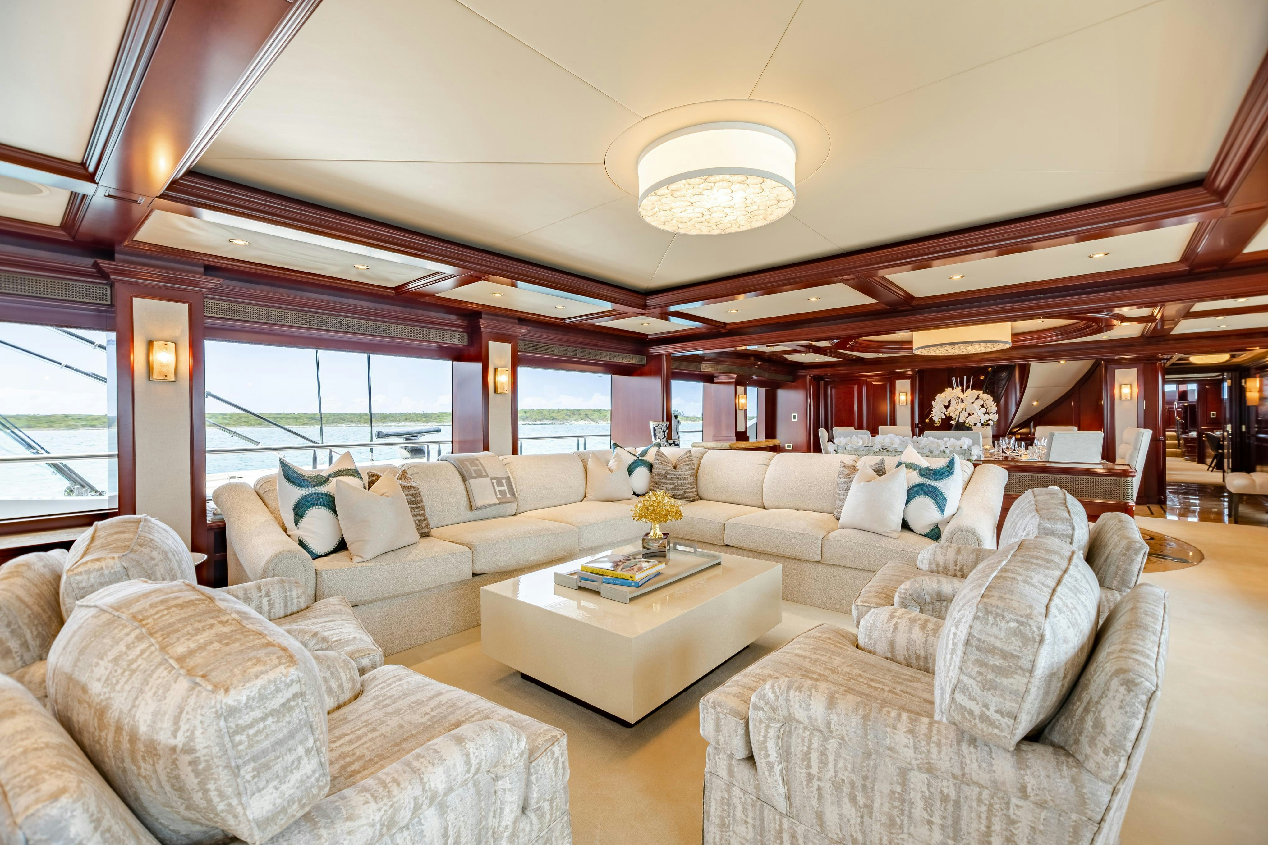 a living room with a large window aboard TCB Yacht for Charter