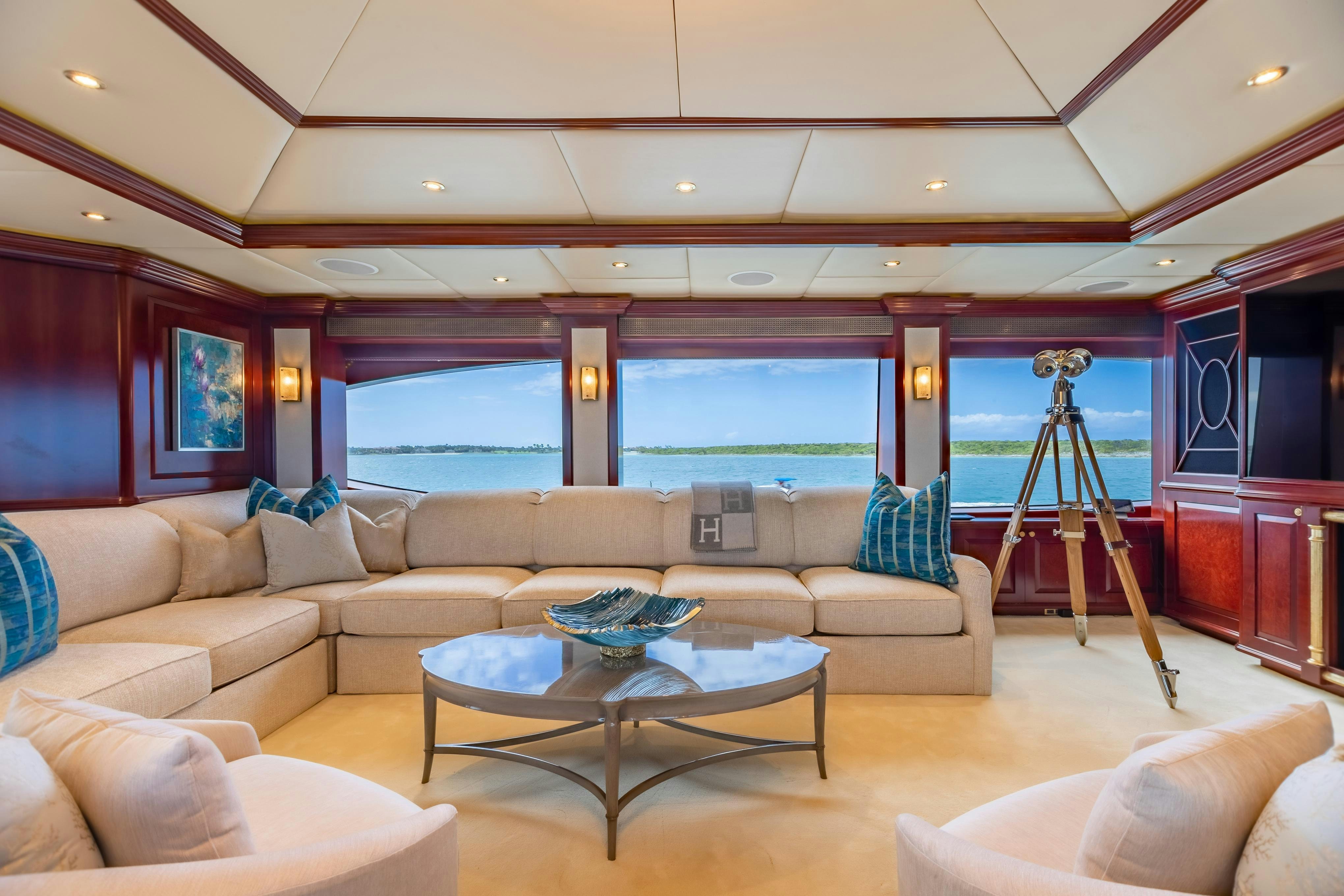 a living room with a large window aboard TCB Yacht for Charter