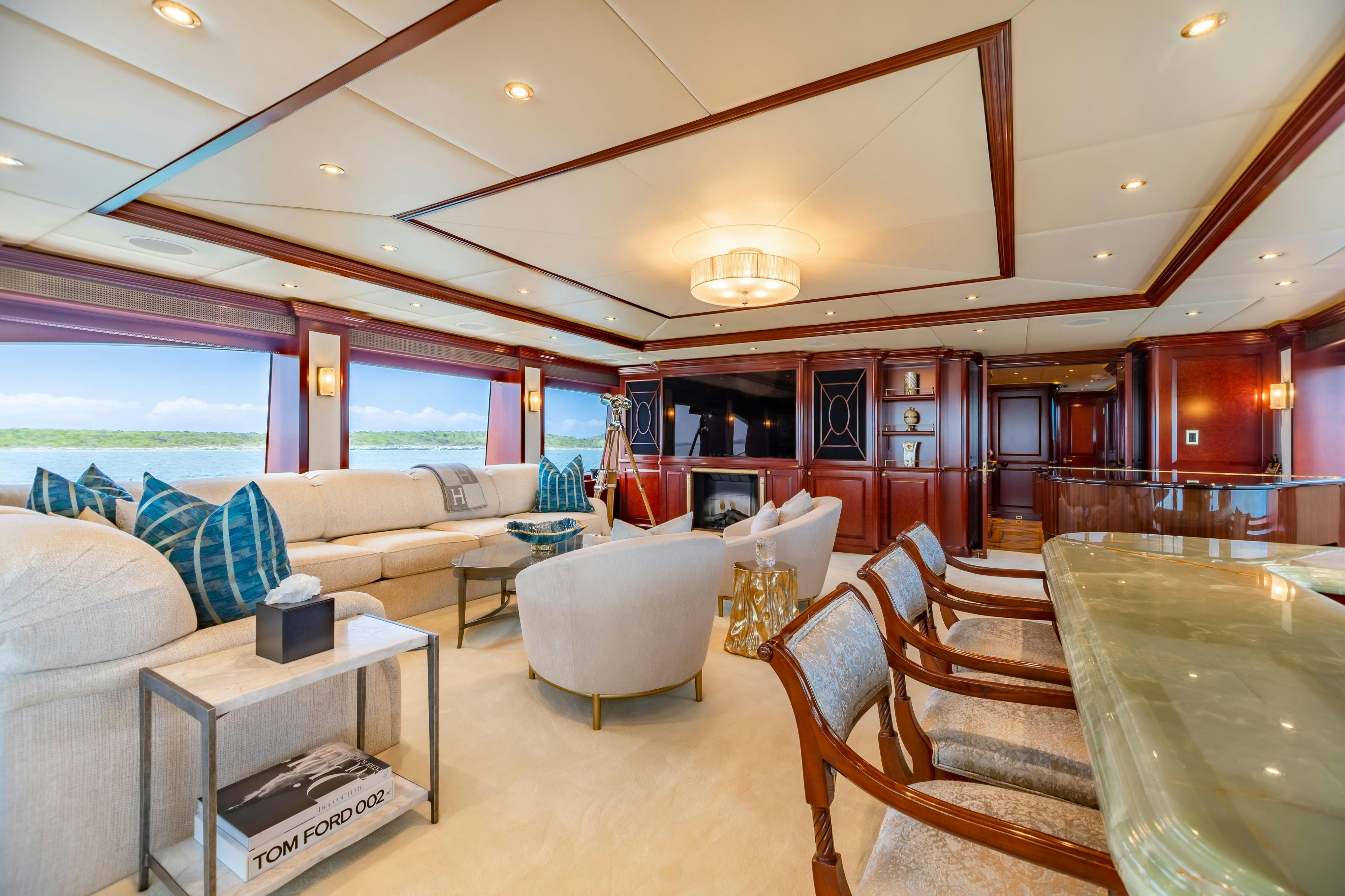 a living room with a large window aboard TCB Yacht for Charter