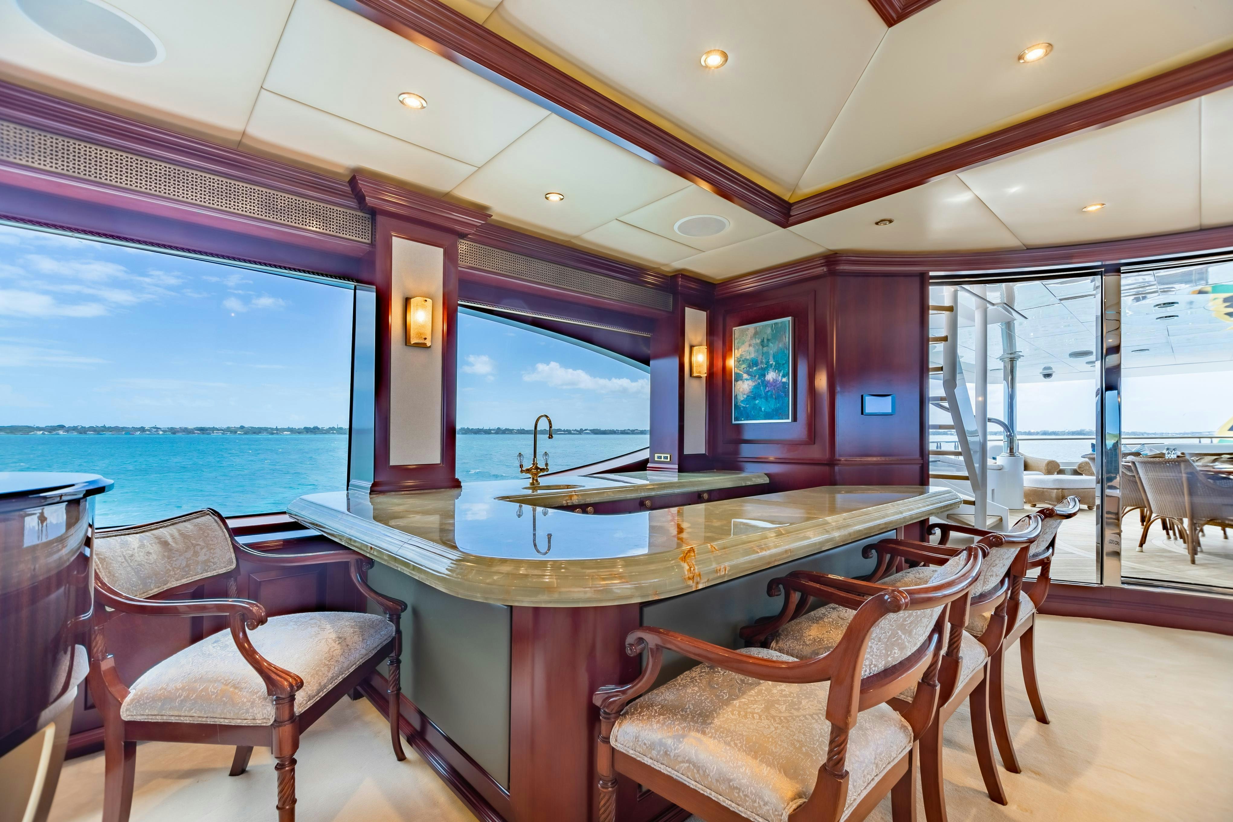 a bar with a table and chairs aboard TCB Yacht for Charter