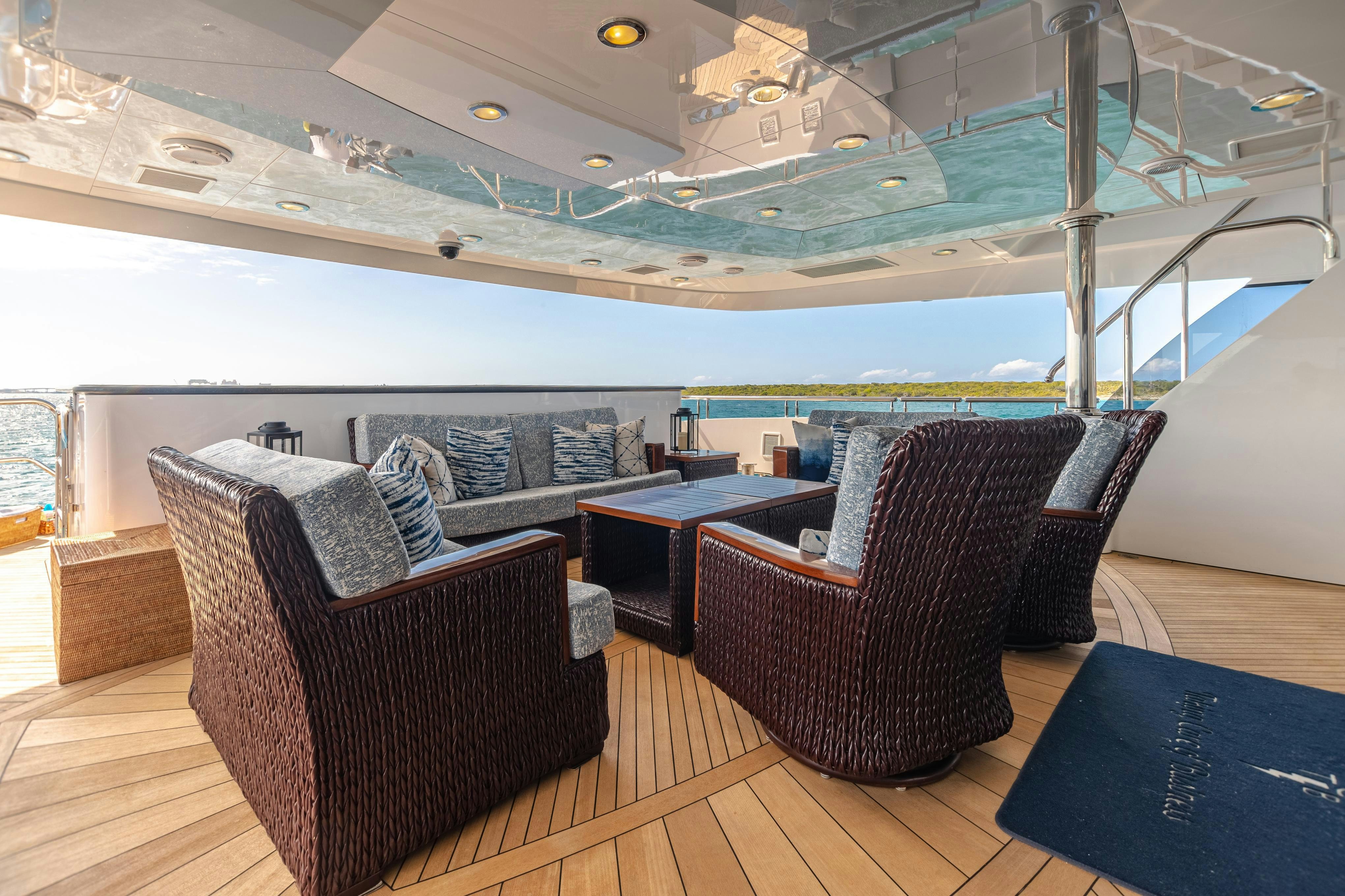 a room with a couch and a table and chairs aboard TCB Yacht for Charter