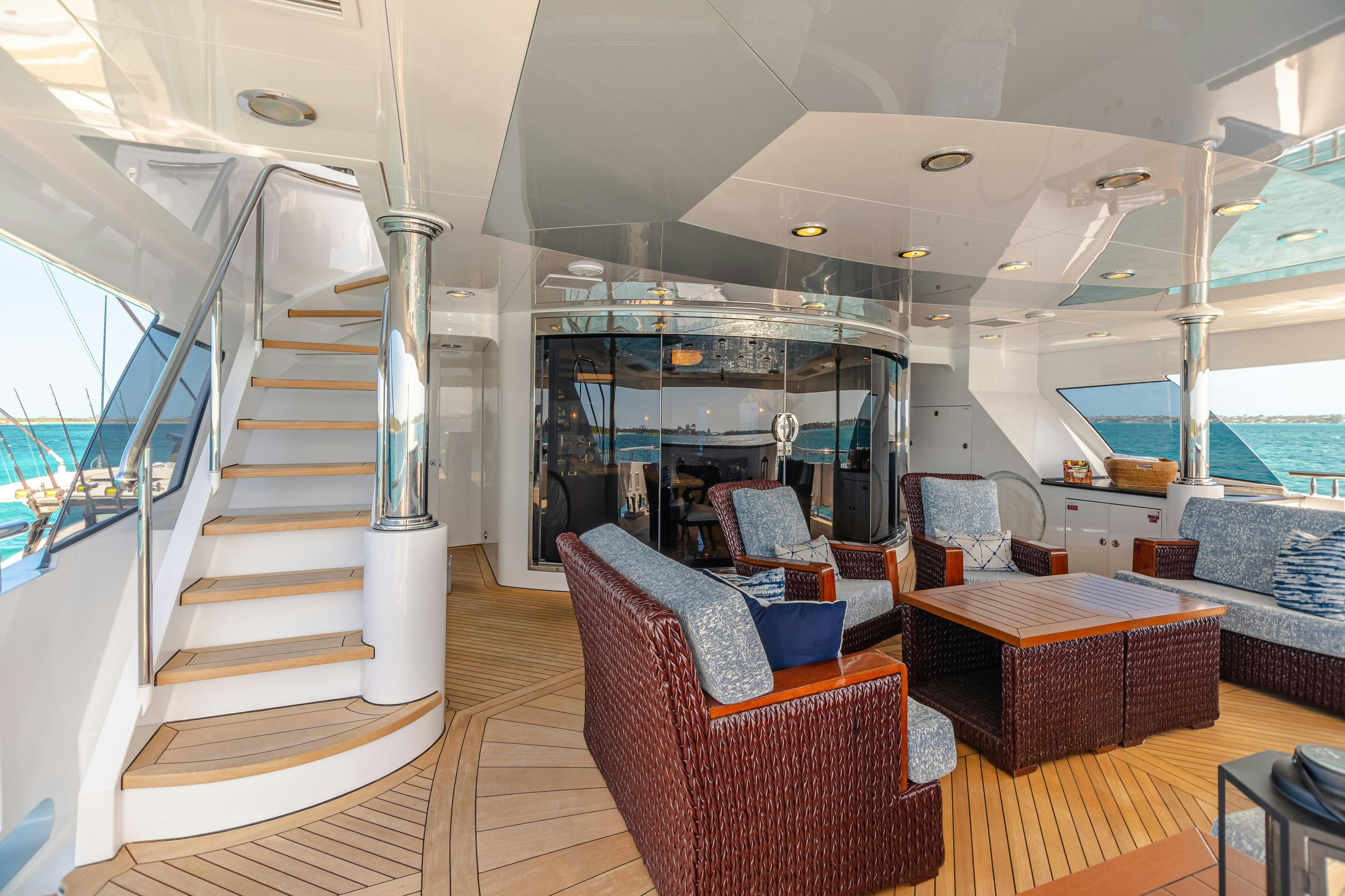 a large living room with a staircase aboard TCB Yacht for Charter